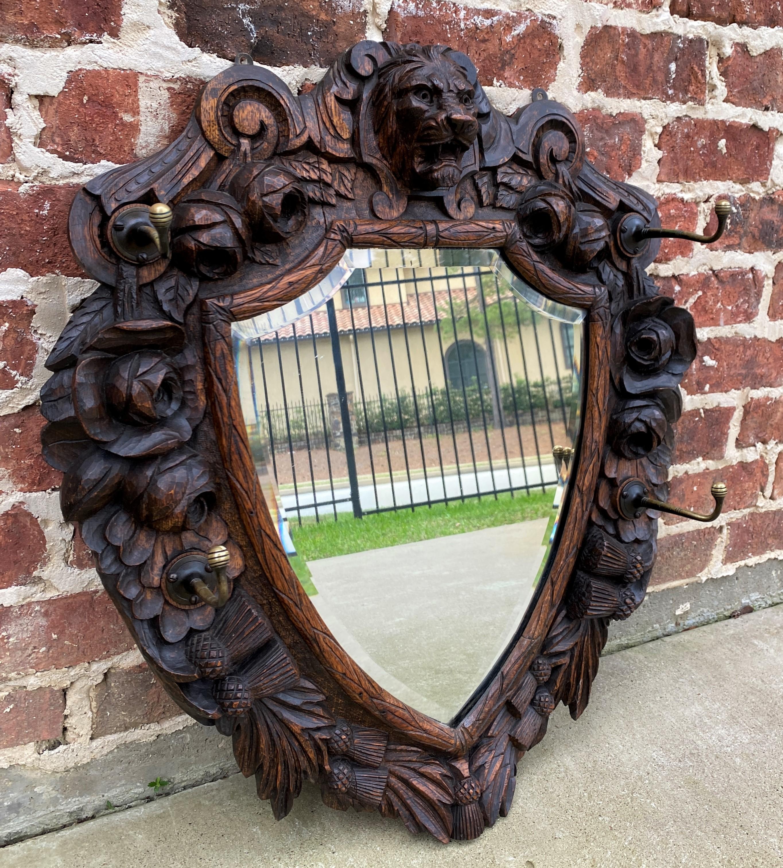 Antique English Mirror Renaissance Revival Oak Frame Shield Shape Lion Wood Back In Good Condition In Tyler, TX