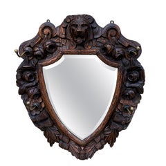 Antique English Mirror Renaissance Revival Oak Frame Shield Shape Lion Wood Back