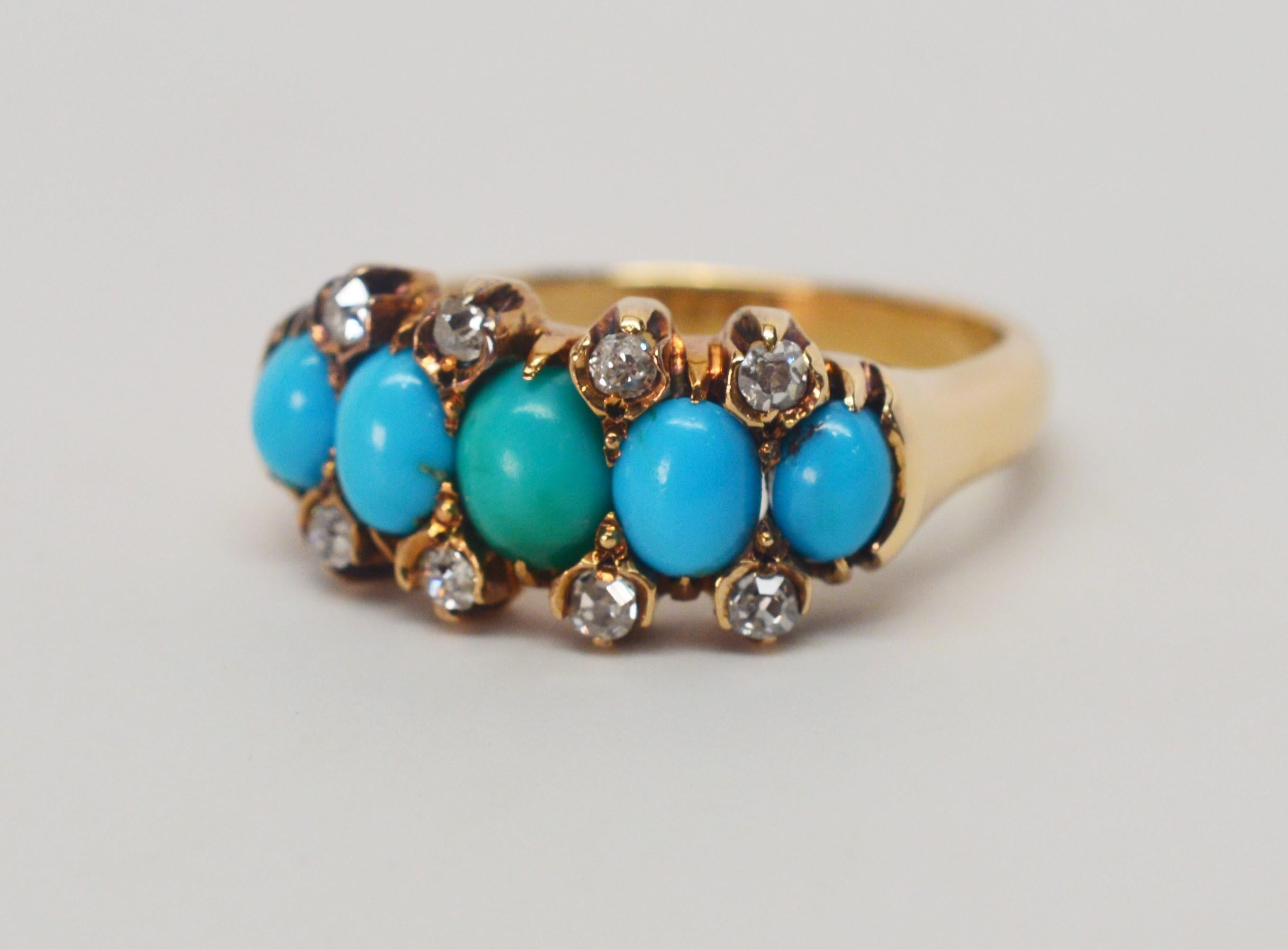 Five oval cut blue green natural turquoise stones accented by eight rose cut diamonds crown this simple fourteen carat antique gold band.
Natural stones with some veining, the center stone is of green turquoise and the side stones are complimenting