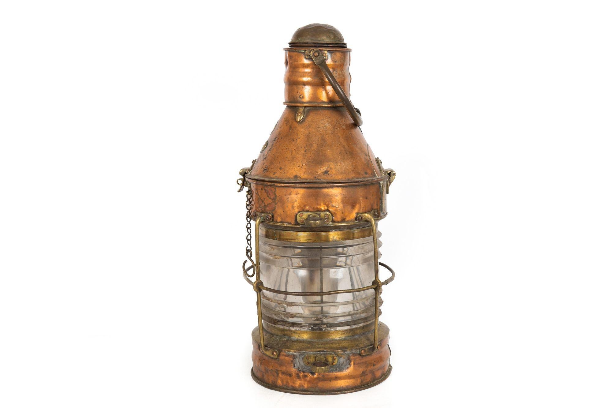 VERY LARGE ENGLISH COPPER SHIP'S ANCHOR LANTERN BY E. BACON & CO
With original maker's plaque
Item # 301GPK23P 

A very large and beautifully aged ship's anchor lantern by the firm of E. Bacon & Co of Grimsby, England, it has an applied plaque on