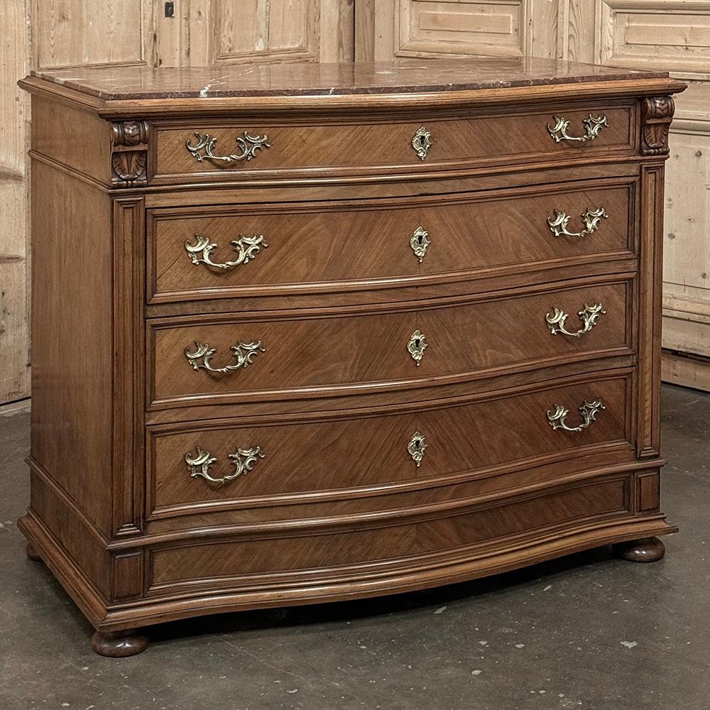 Antique English Neoclassical Marble Top Walnut Chest of Drawers was designed to add stately flair to any room, while providing abundant storage and a carefree surface.  The brick red finely veined marble top sits inside the beveled and contoured
