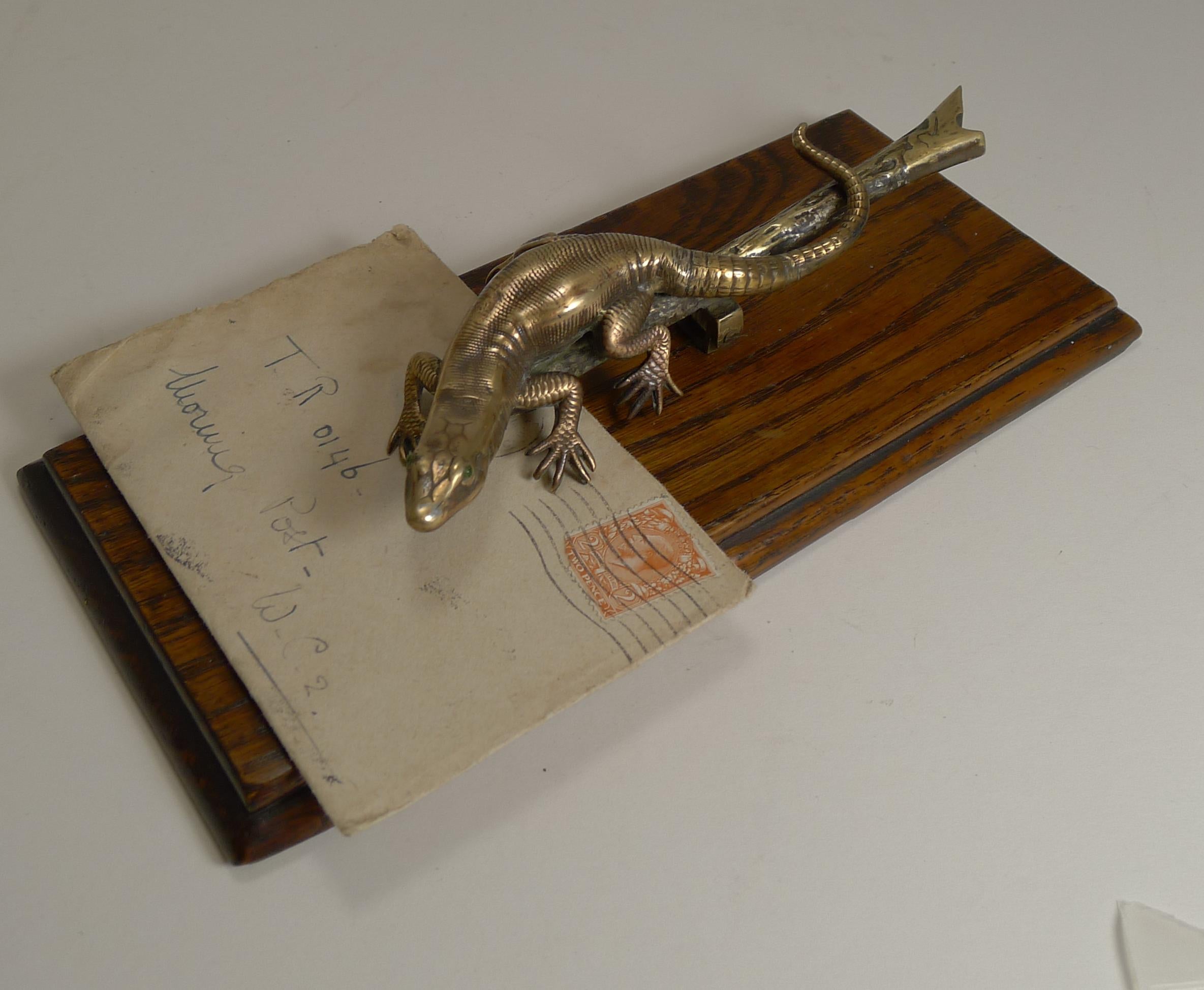 A fabulous novelty desk-top letter clip sporting a wonderful lizard on a naturalistic branch and retaining his two little green glass eyes.

The sprung clip is perfect for business cards to keeping those stray notes in order. The sprung clip has a
