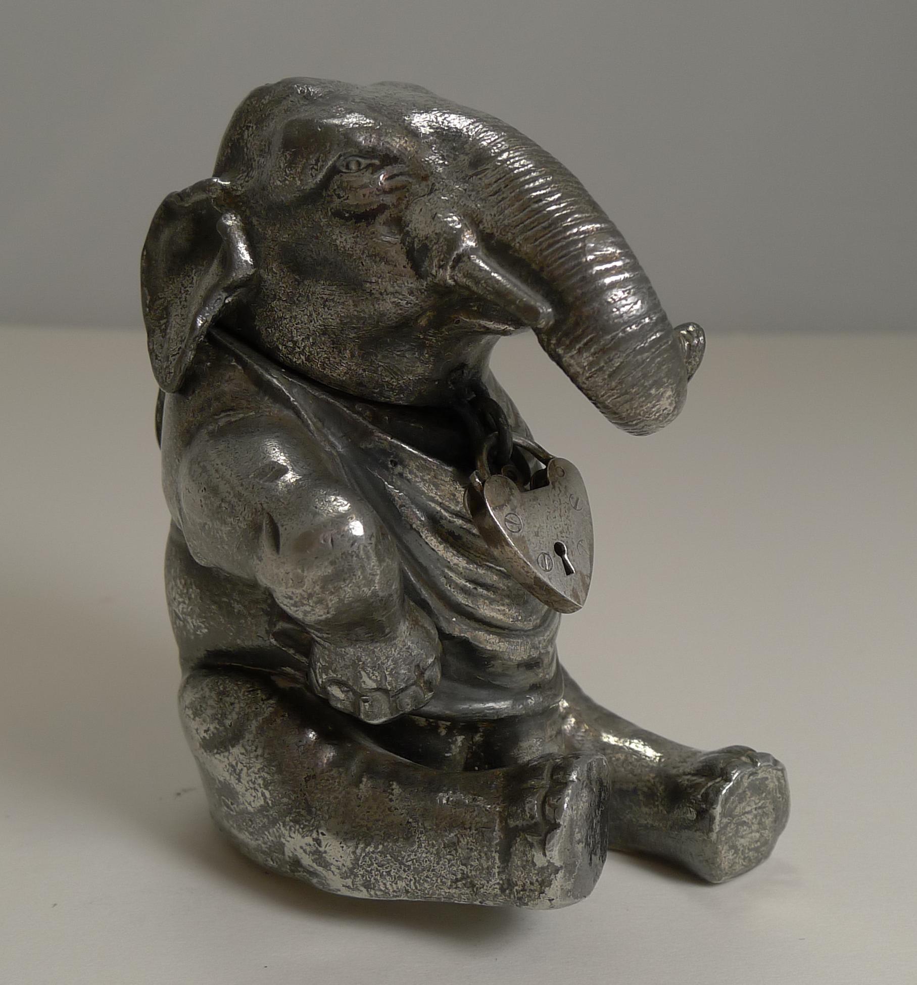 A highly sought-after and scarce little money box or bank in silver plate with a fabulous antique patina.

The box was made in the from of a Elephant with a heart shaped lock to the front (these don't actually lock), the lock opens and snaps back