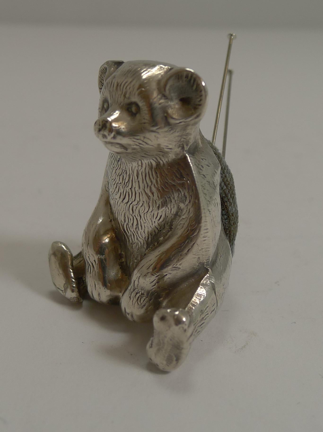 A highly collectable small novelty pin cushion in the form of a sitting Teddy Bear.

Beautifully executed with full English hallmarks for Birmingham 1909, Edwardian in era. The makers mark is also present for W J Myatt & Co Ltd.

Excellent