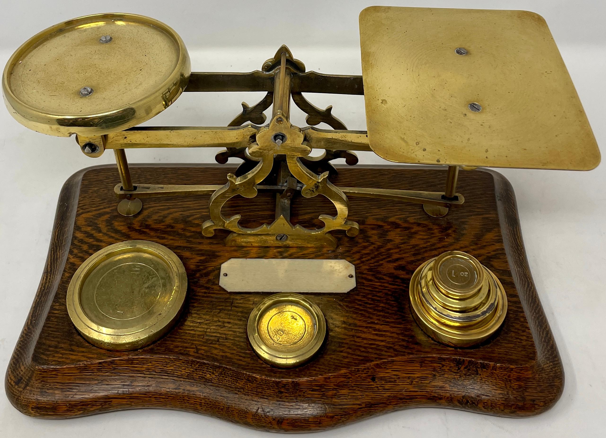 Antique English oak and brass postal scale.