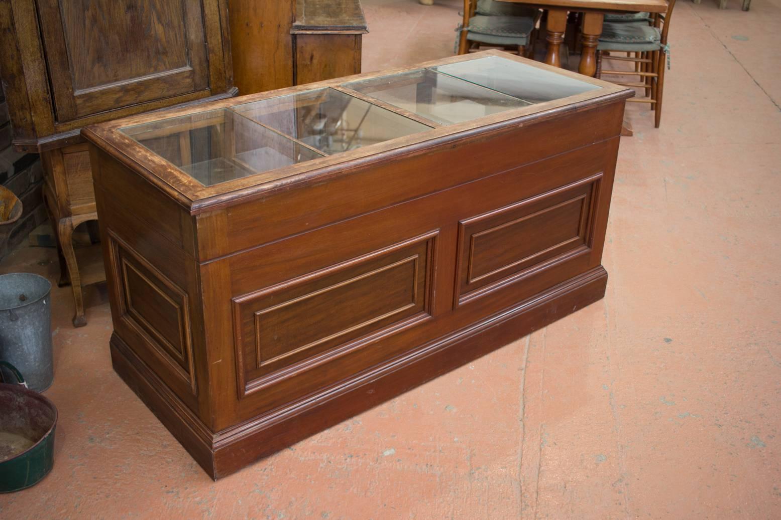 Antique oak and mahogany haberdashery cabinet with inset glass panels to top over wooden slides and fall front cupboards.
 