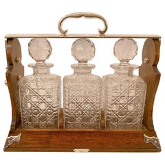 Antique English Oak and Silver 3 Bottle Crystal Tantalus, "Betjemann" circa 1860