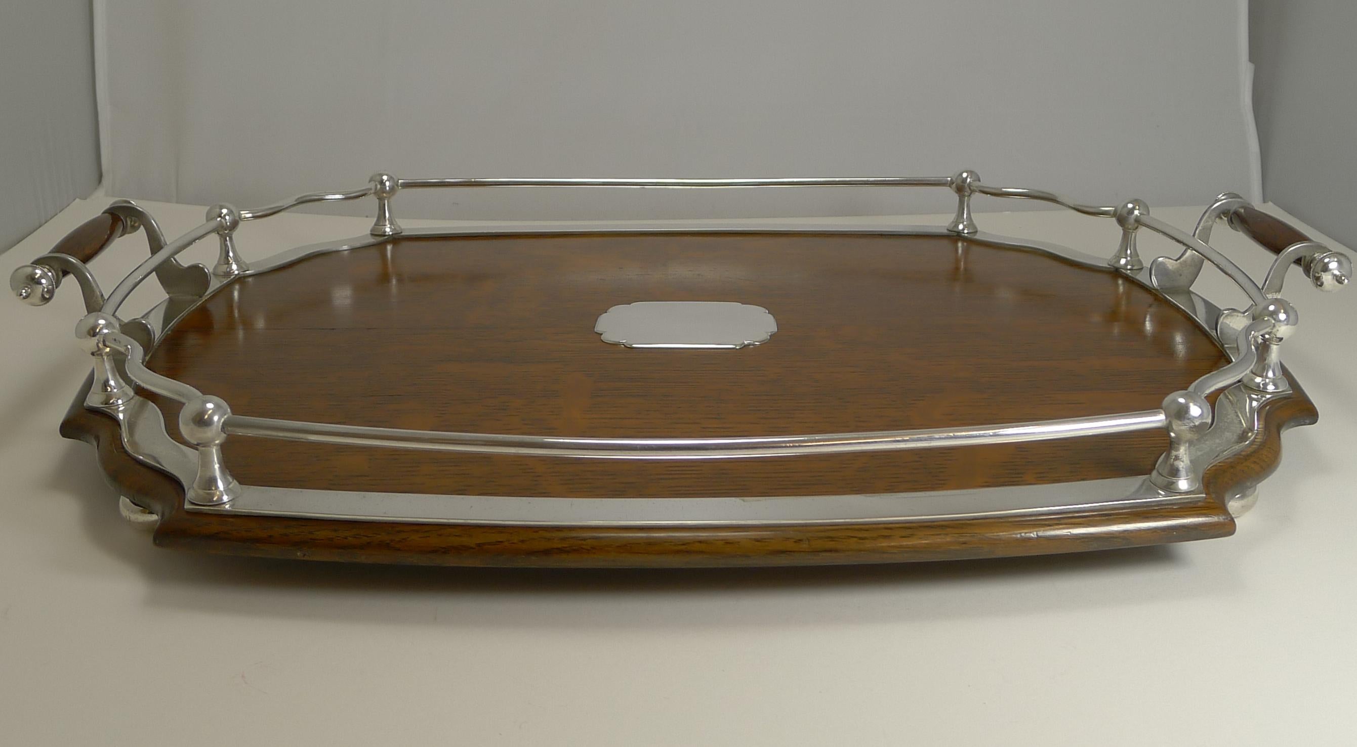 A most handsome late Victorian / early Edwardian cocktail / serving tray, creates a great look for your drinks display paired together with other complimentary pieces (these are not included).

Made from a solid English oak and standing on four