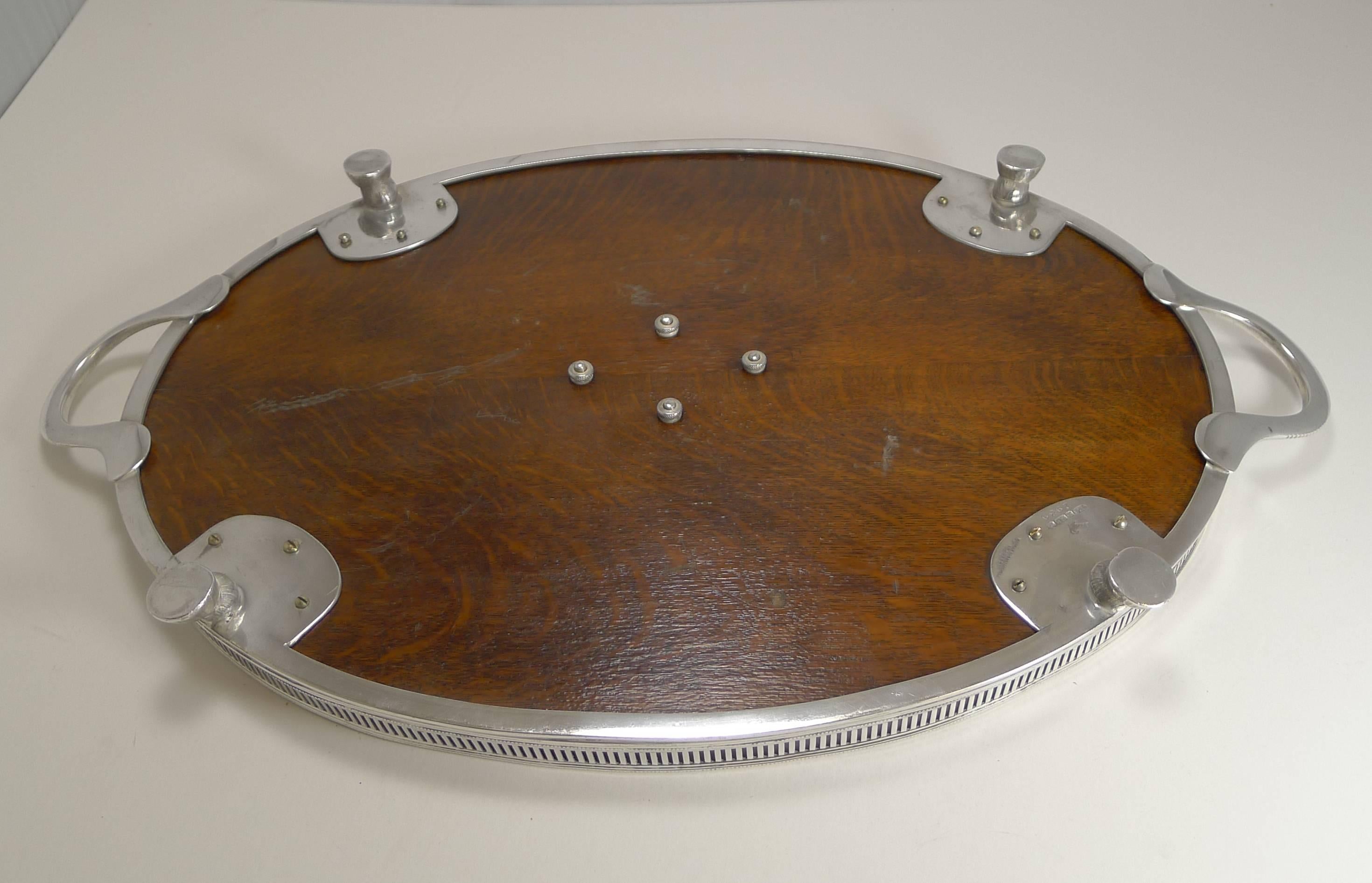 A delightful and highly sought-after tray by the well renowned silversmith, Roberts and Belk and dating to circa 1890-1900.

What makes this a charming example are the four original horse hoof feet which it sits on. The solid English oak base is