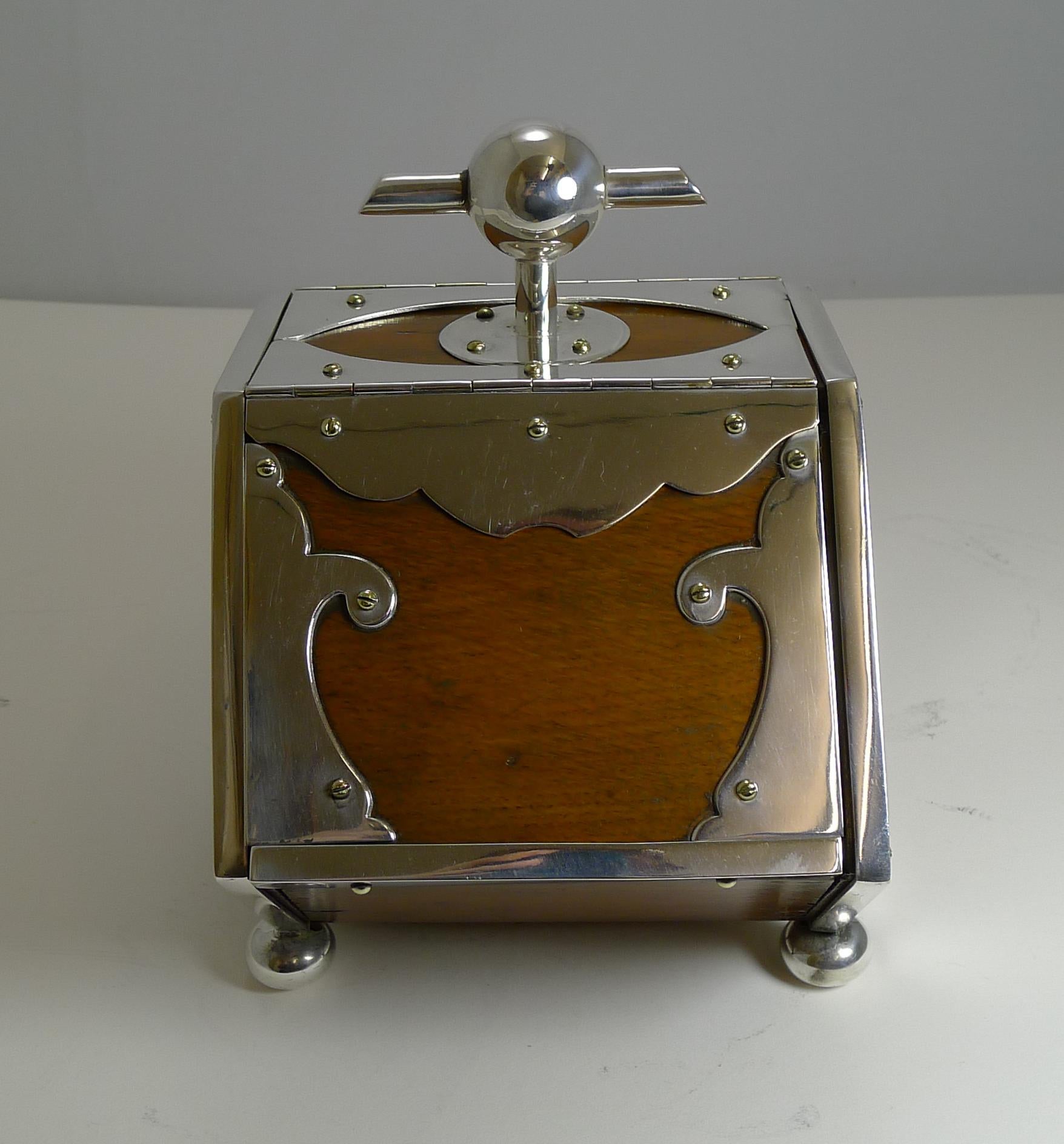 A wonderful late 19th century biscuit box made from solid English Oak with silver plated fittings, always a winning combination and highly sought-after.

The box has two lift up lids into the metal lined interior, lovely and clean and perfectly