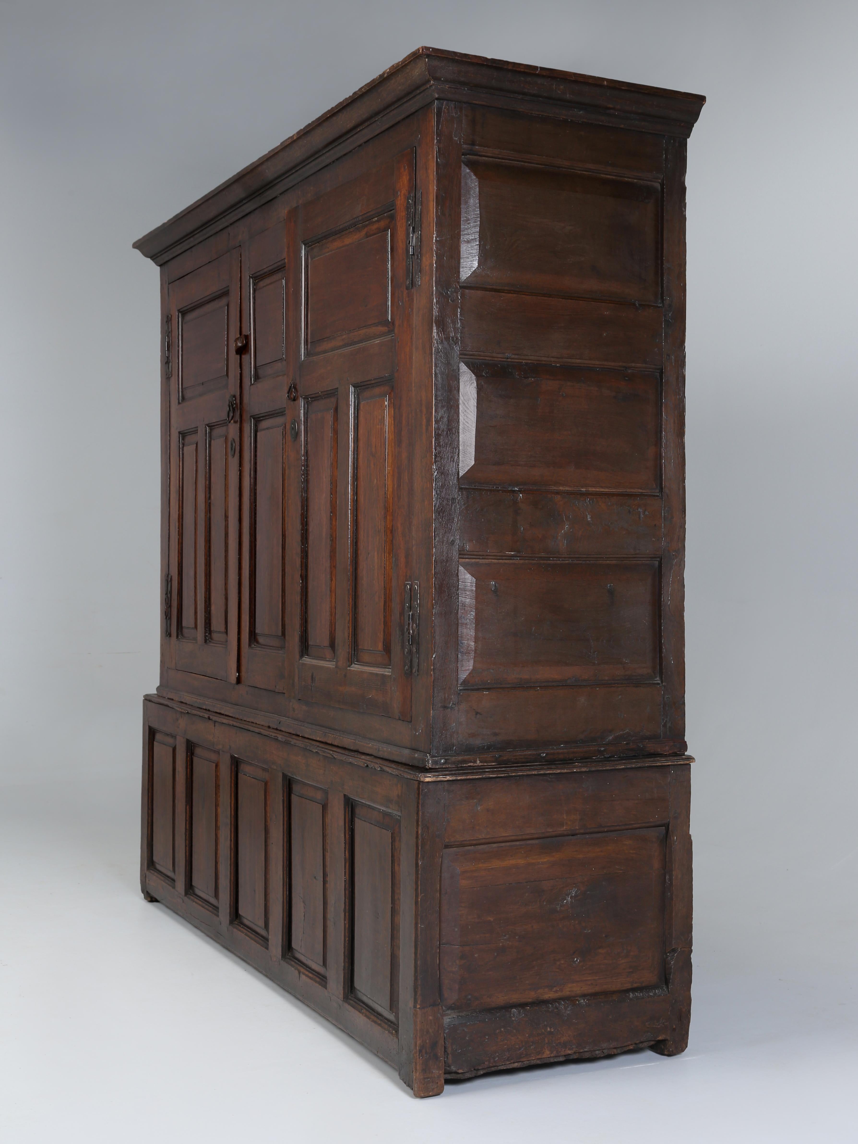 Antique English Oak Baker’s Cupboard with two moulded panel doors from the early 1700’s and appears to be completely unrestored and unbelievably does not require restoration. The last owner used the Antique English Baker’s Cupboard as a Hall Coat