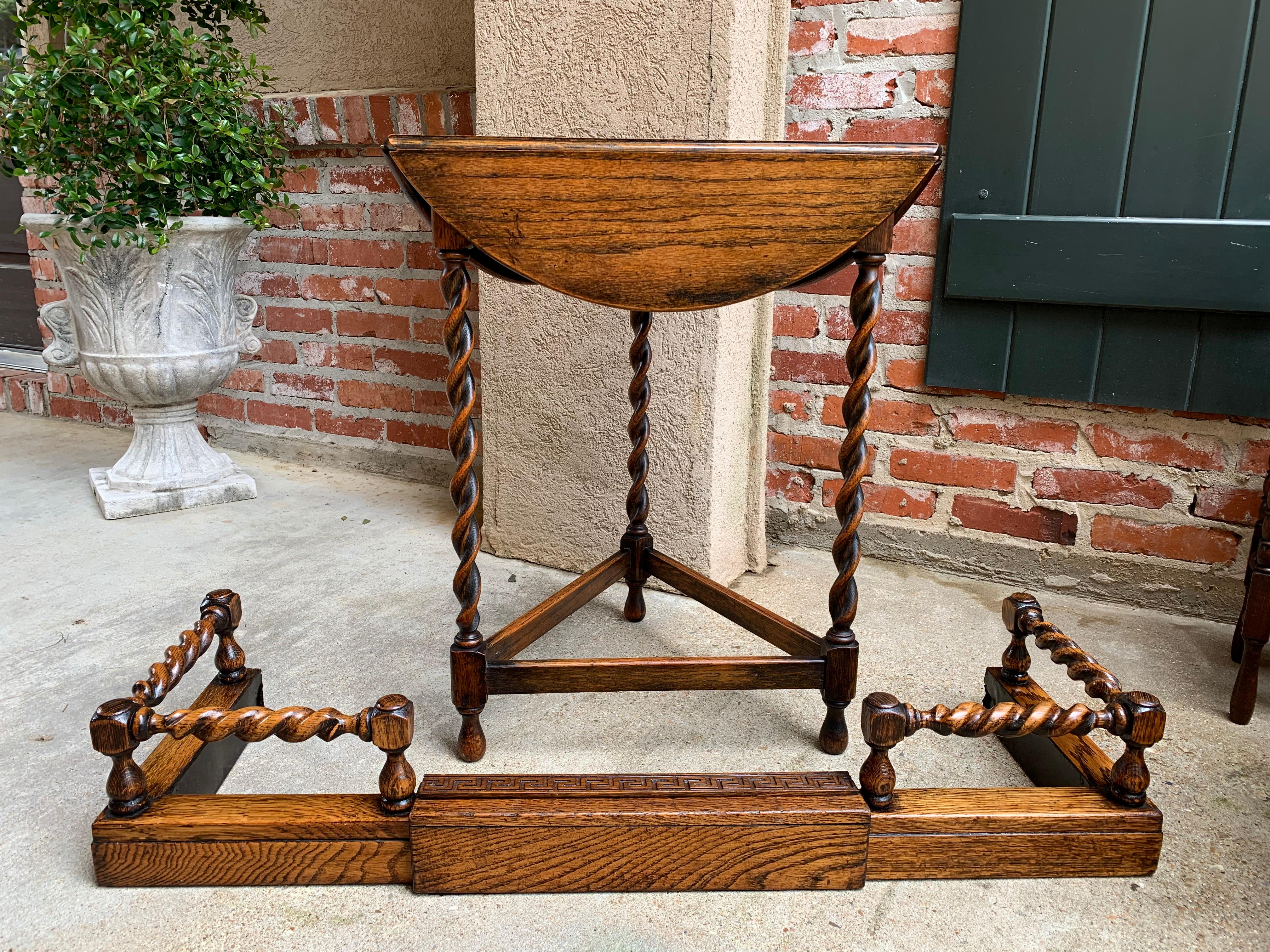 Direct from England, a very unique antique English oak barley twist fireplace fender, perfect old world charm for any fireplace!
~ British barley twist rails between the turned posts with block corners
~ Center sleeve has carved Greek Key (two