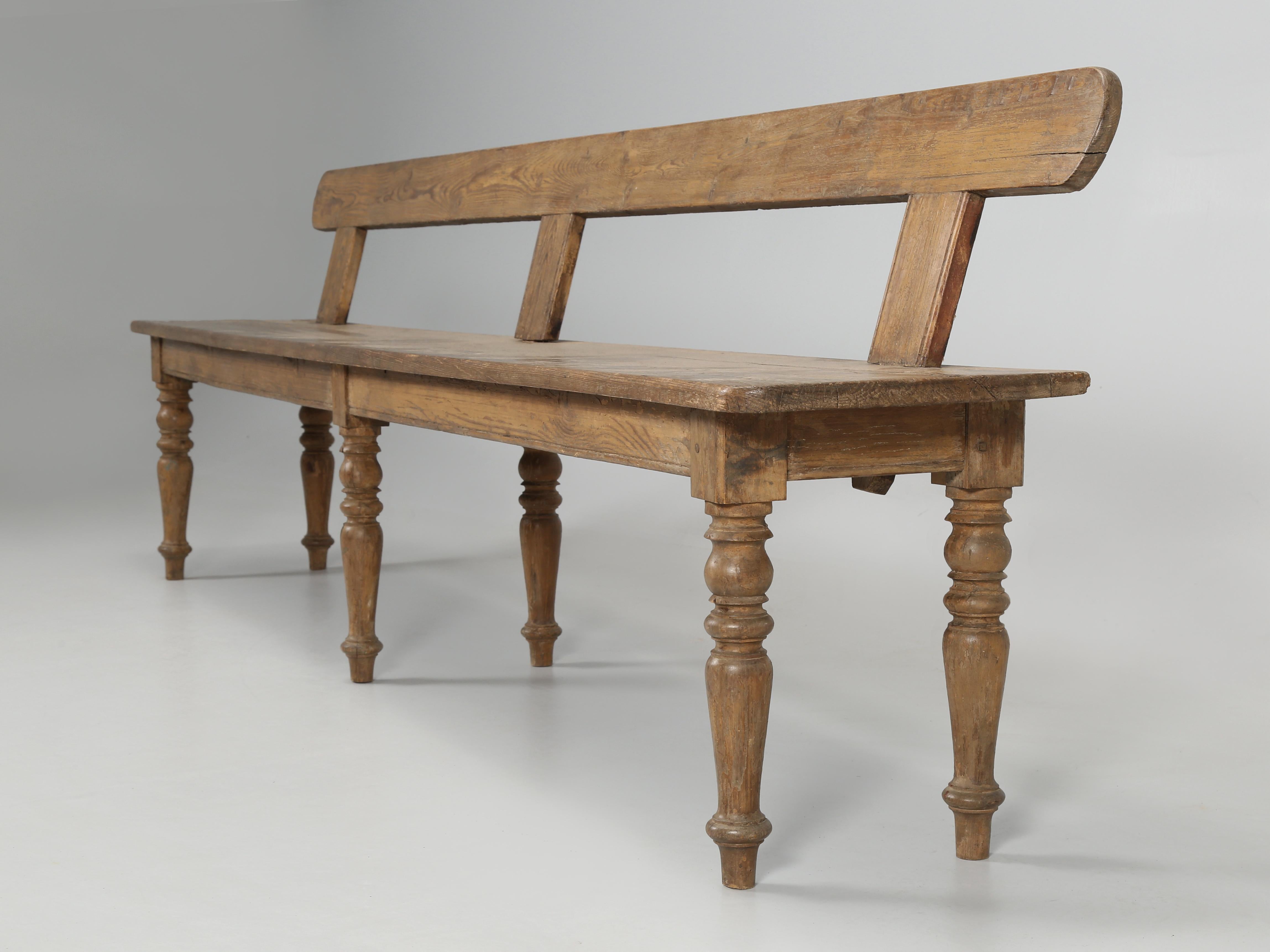 Beautiful antique English bench crafted from solid white oak in the late 1800’s. The patina is a bit of a fooler, for at a quick glance you would think that our antique English country style bench, was just a very nice worn old white oak. However,