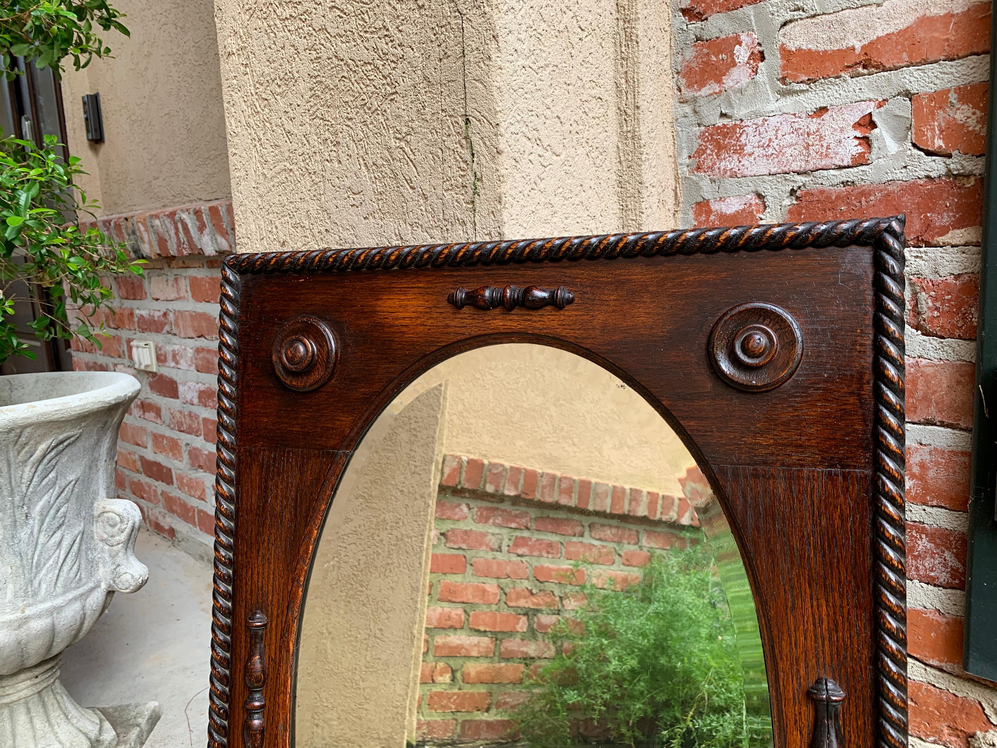 Arts and Crafts Antique English Oak Beveled Wall Mirror Barley Twist Frame Oval, circa 1900
