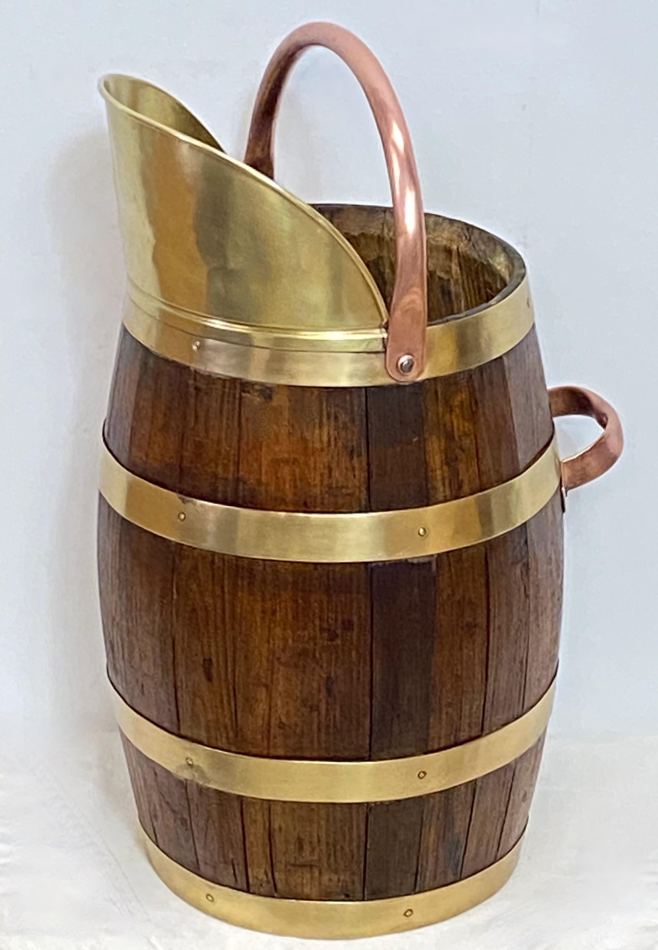 Wonderfully aged oak bucket or large pitcher with brass banding, handle and spout.
England, Mid-19th Century.