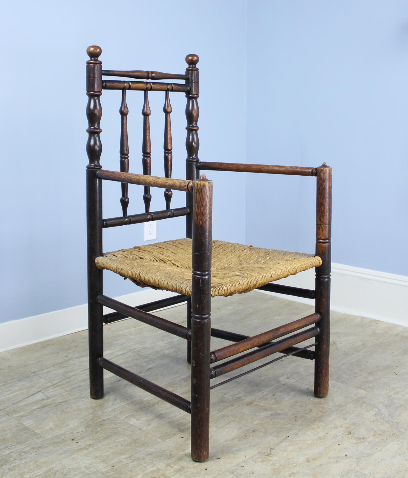 A glorious 18th century antique oak carver's chair, made specially for the head of the table, or the 