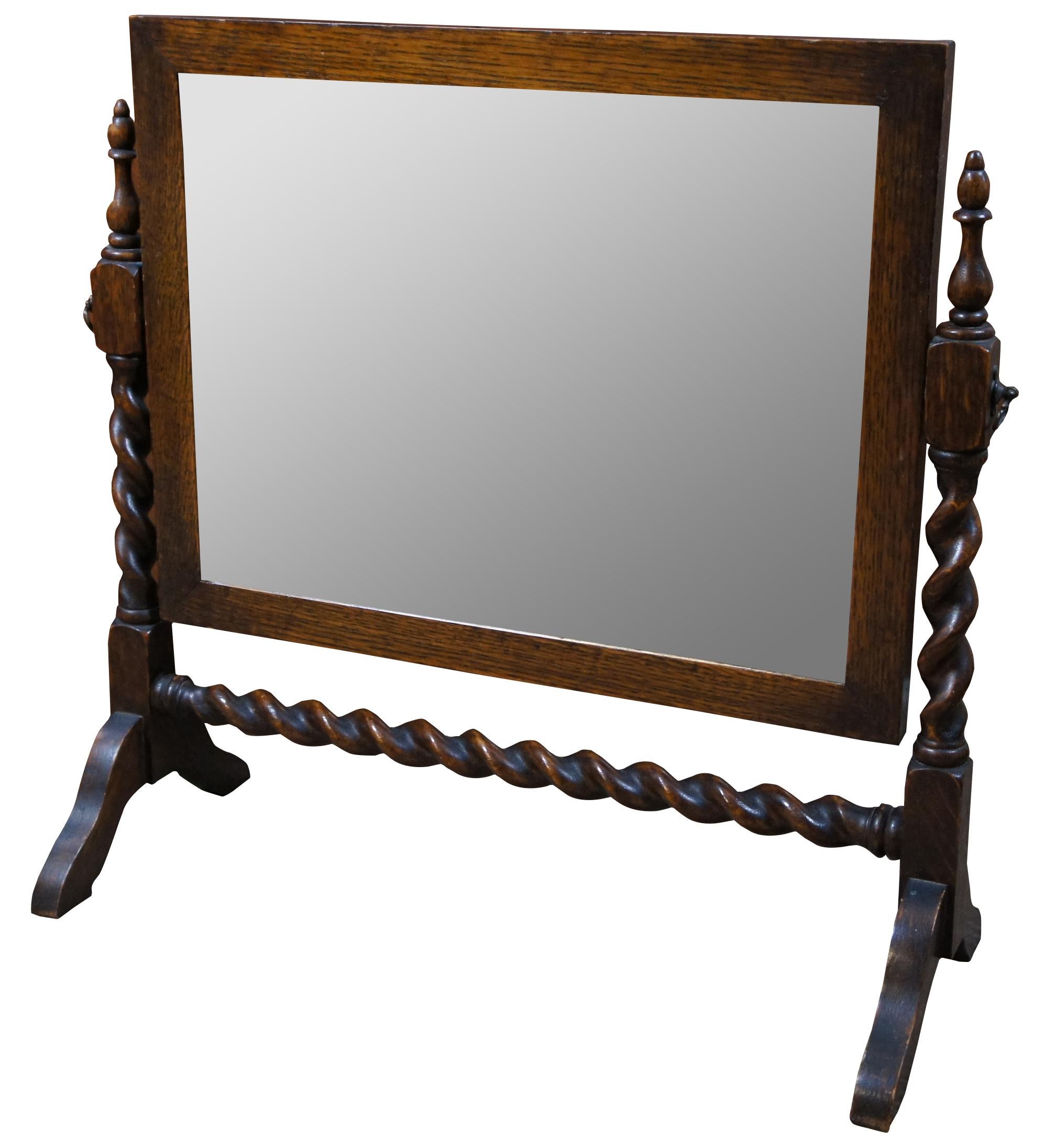 Antique Victorian oak dresser top Cheval shaving/ vanity mirror. Features barley twist sides and trestle base.

Measures: Mirror - 16.5” x 12.5”, 22