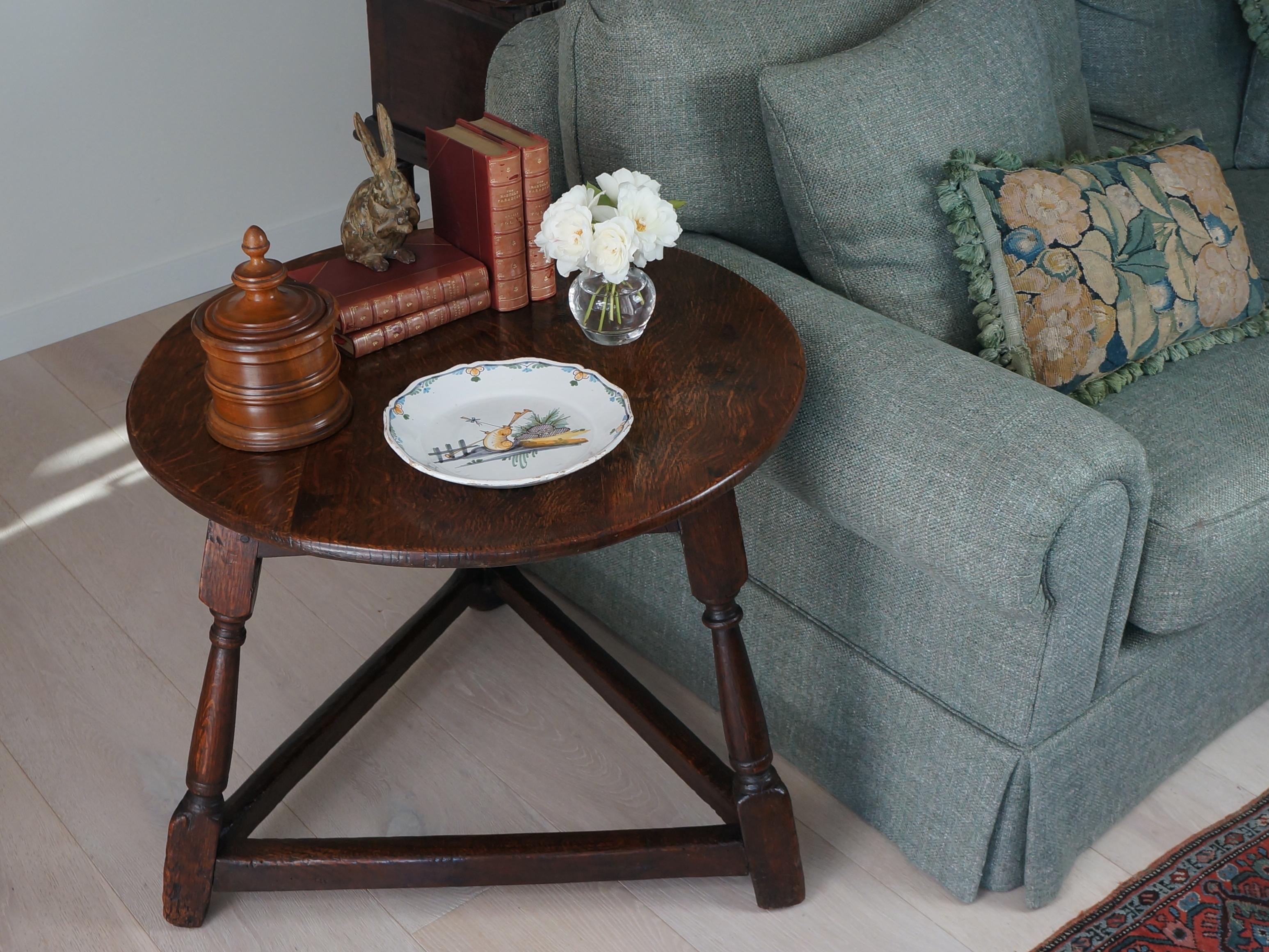 Classic cricket features, two centuries of history, rare charms, and versatility—all with a hint of mystery.

This cricket table has hallmark features. The gorgeous round top is a deep, dark brown. The triangular base is attached with traditional