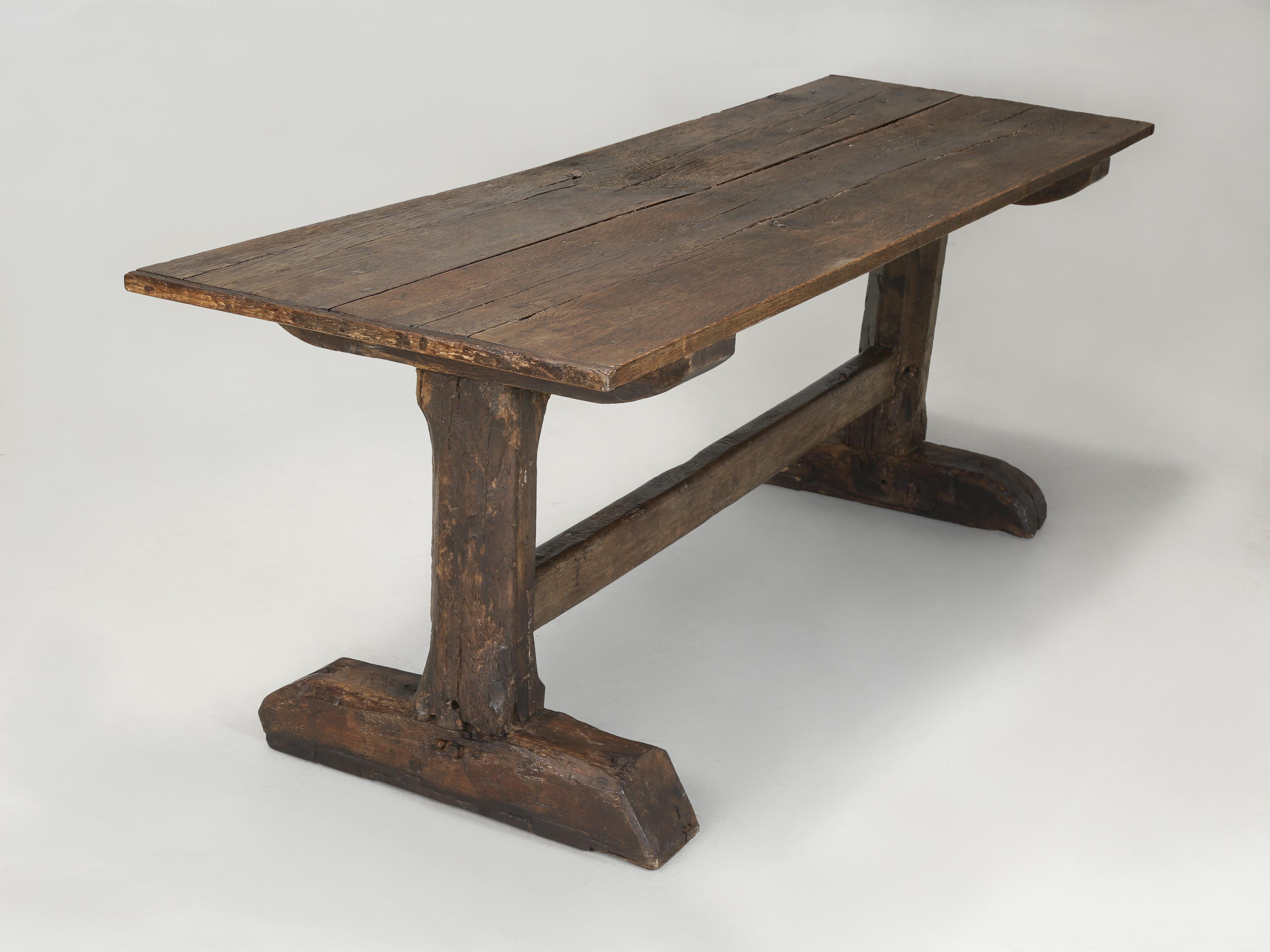Antique English Farm Table or Rustic Trestle Dining Table in Oak. This Country English Farm Table is what Antique dealers dream of finding. Conservatively I would date this English Oak DIning Room Table more than 250-years old and is probably one of