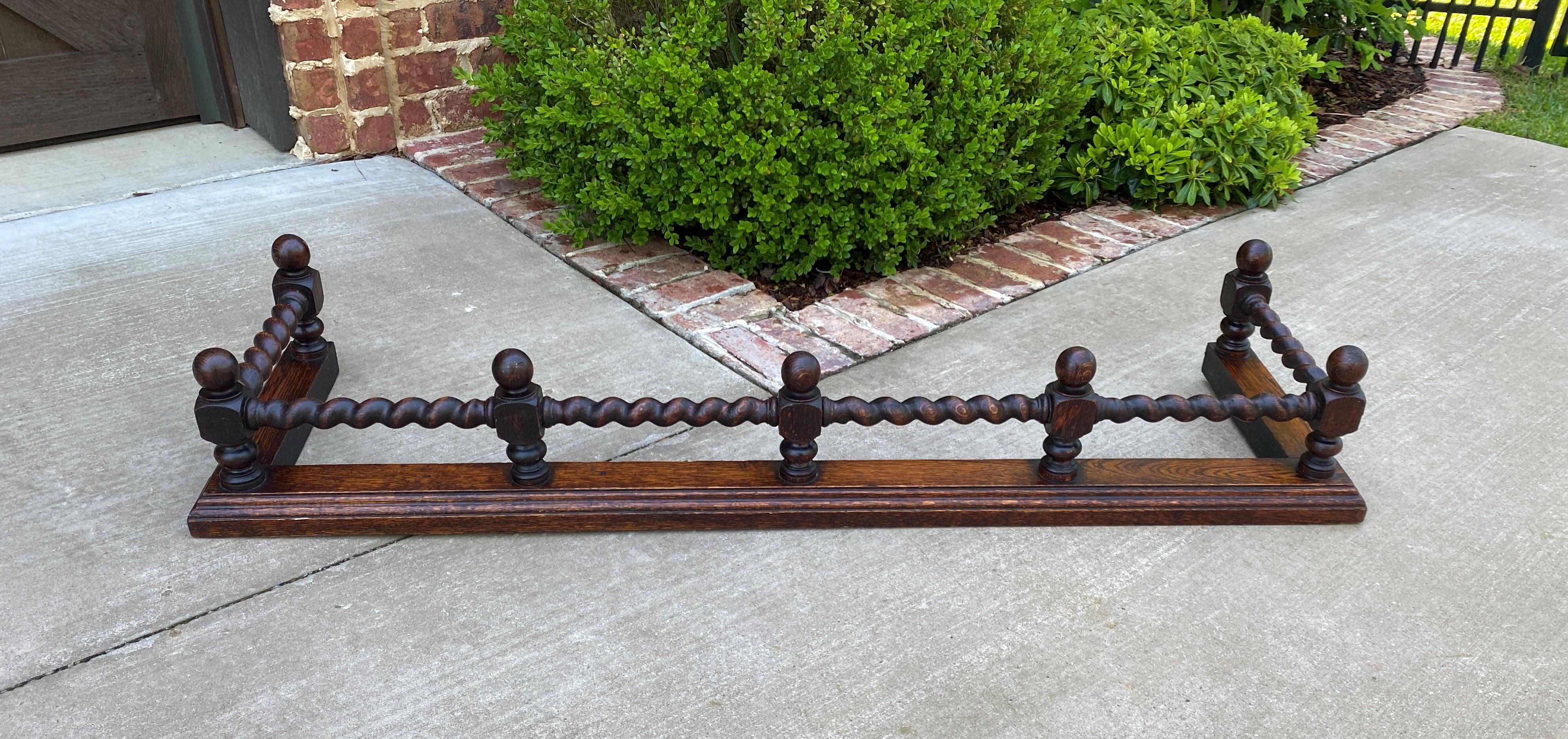 Charming antique English oak barley twist fireplace fender or hearth surround ~~c. 1920s

Wonderful decorative piece to add character and charm to any living area, bedroom or country kitchen fireplace or hearth

Carved barley twist posts~~solid