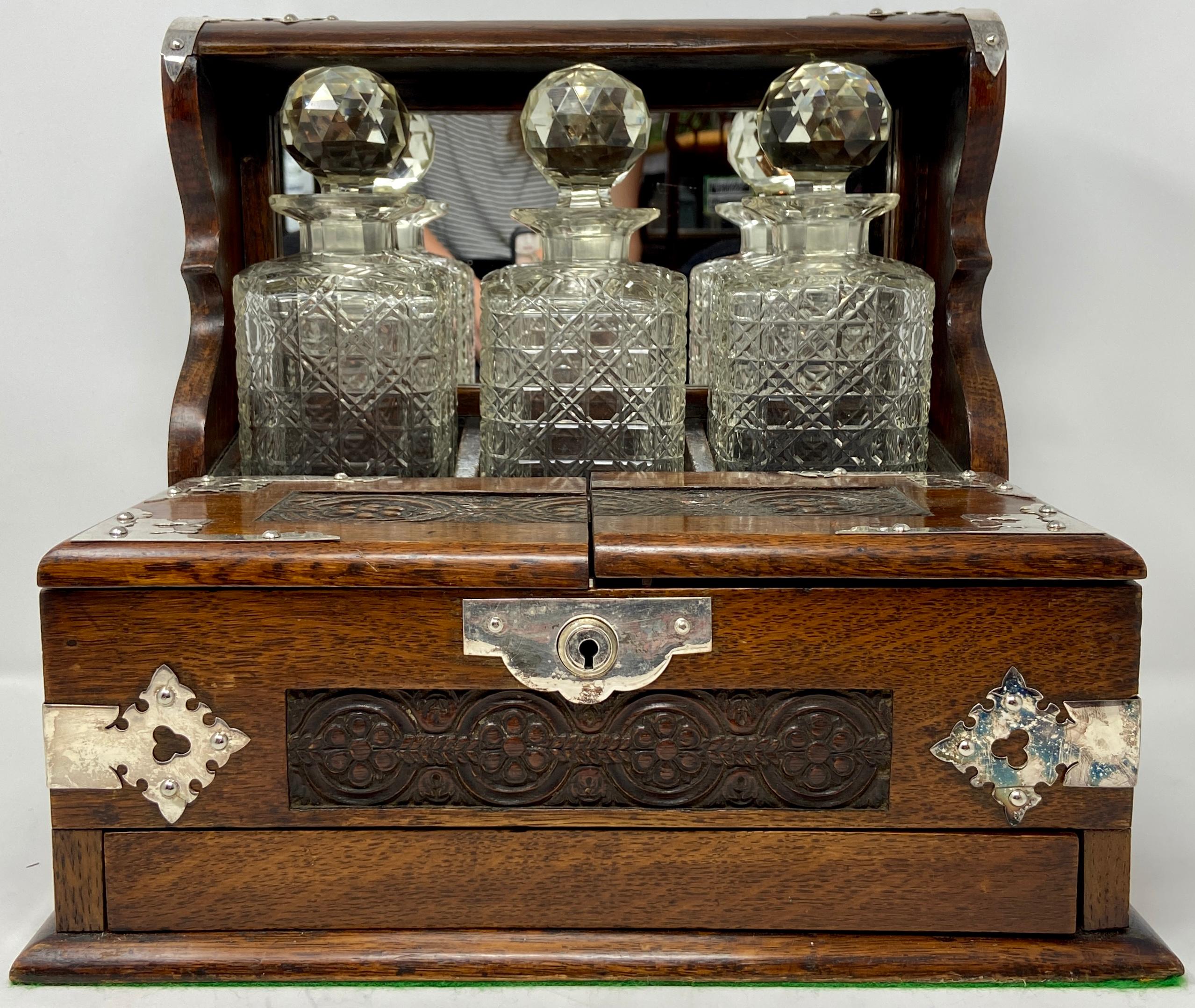 Antique English Silver-Mounted Oak Games Box Compendium 3-Bottle Tantalus with Cordials, Circa 1880.