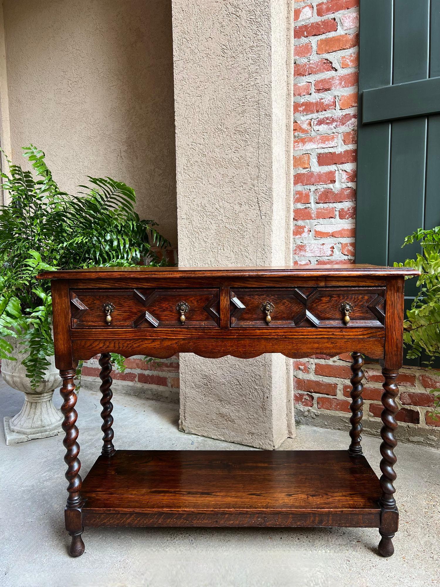 Antique English Oak Hall Sofa Table Console BARLEY TWIST Jacobean Carved Petite.

Direct from England, a charming British console or hall table.
Classic Jacobean style with two geometric paneled drawers and original brass drop drawer pulls with a