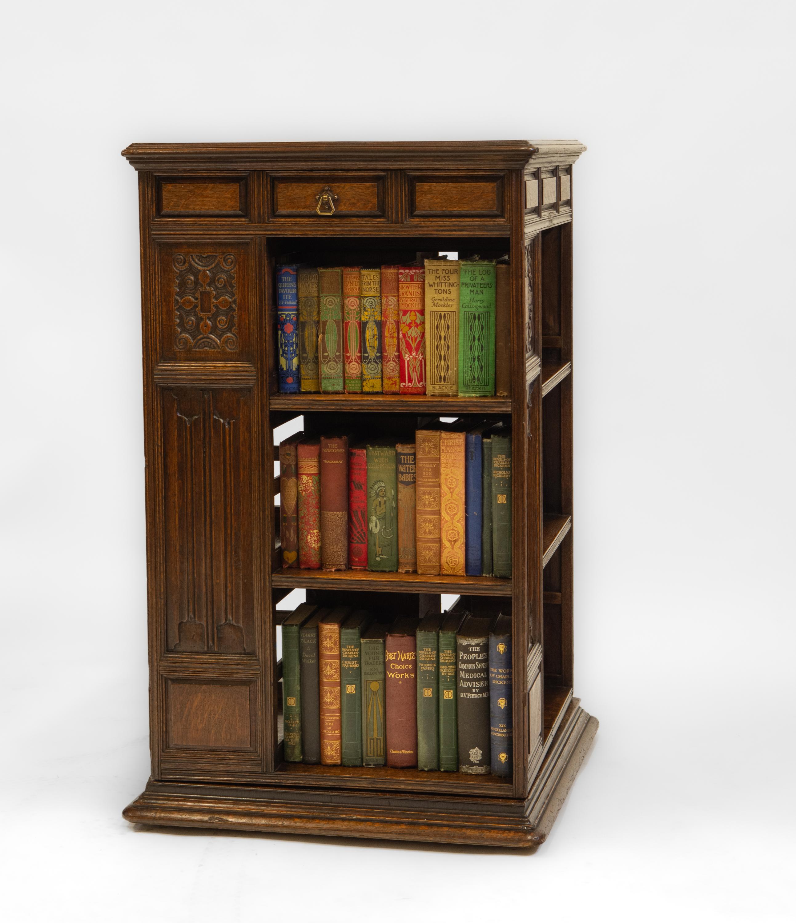 Superb 19th century large oak revolving bookcase with drawer. English - Circa 1870.  Colman's Mustard Family Provenance. Labelled. 

The bookcase is of very good quality. A beautiful and unusual variation on the more ubiquitous slatted design, each