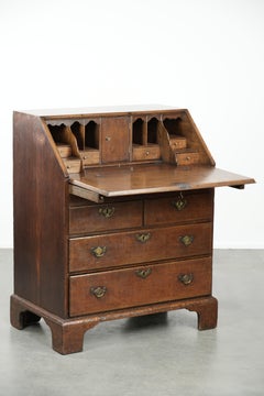 Antique English oak secretary from the 18th century with a stepped interior