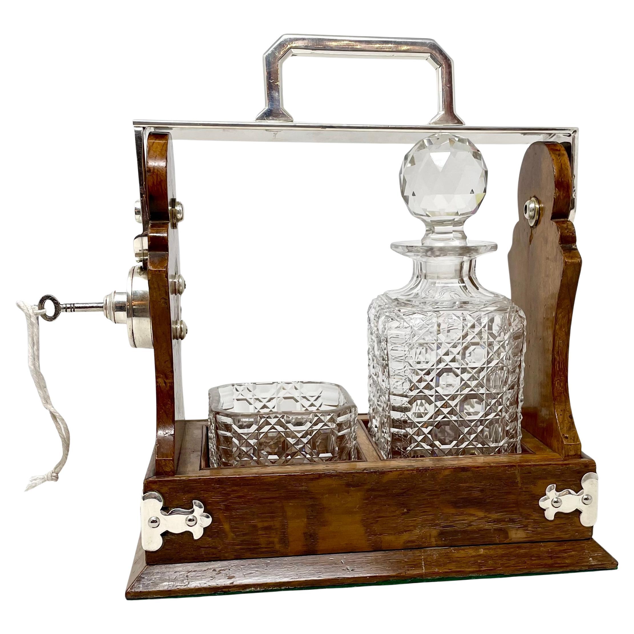 Unusual Antique English oak, silver-plate and cut crystal one-bottle tantalus and cigar holder, circa 1890's.