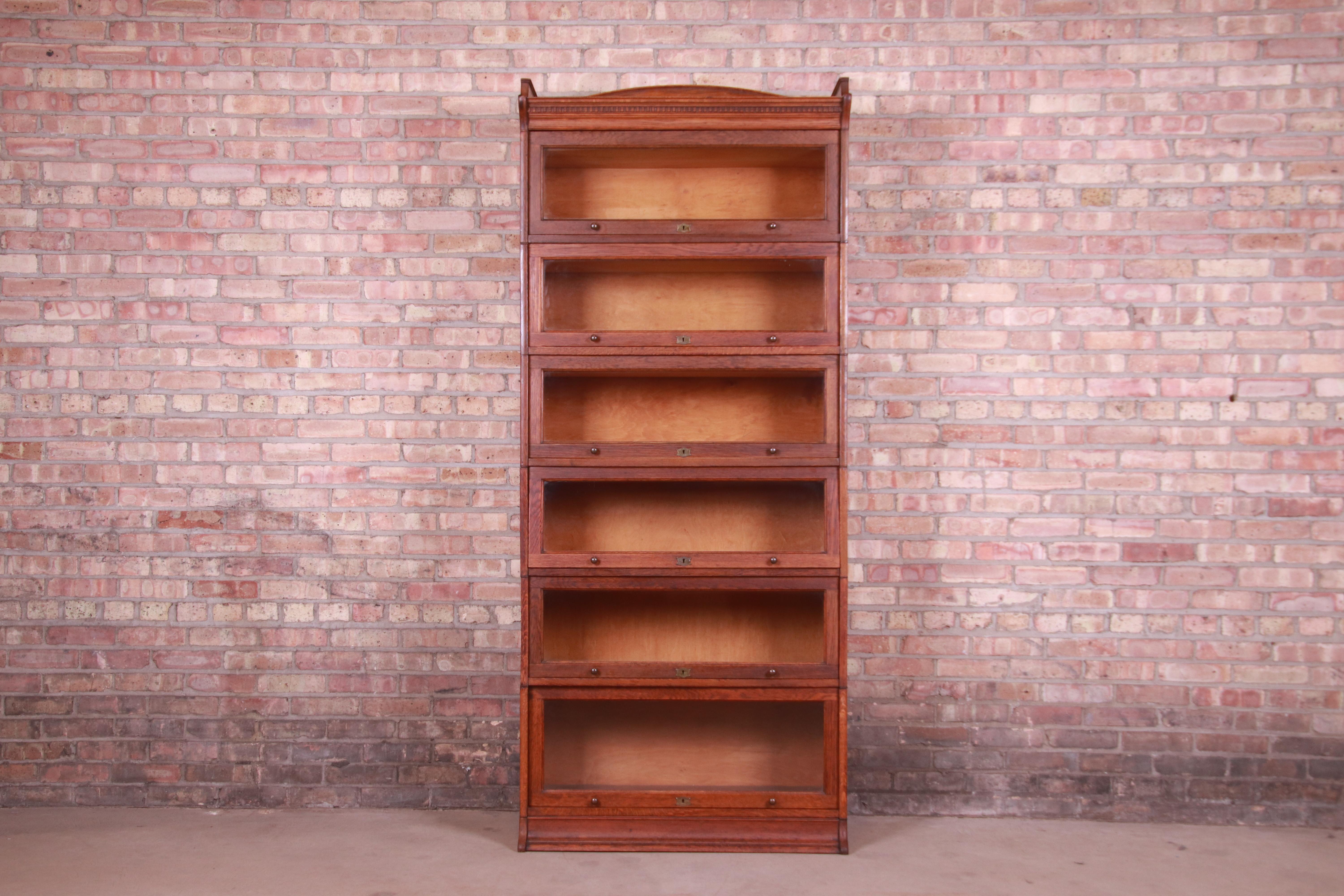 A gorgeous antique Arts & Crafts six-stack barrister bookcase

By Lebus

England, Circa 1890s

Oak, with glass front doors and original brass hardware.

Measures: 34.75
