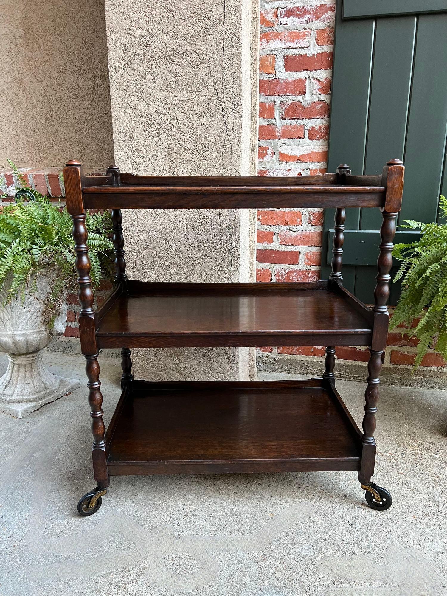 Antique English Oak Tea Trolley Wine Bar Serving Cart 3 Tier British Dumbwaiter.

Direct from England, a beautiful antique English oak tea trolley or “dumbwaiter” serving cart. Excellent for entertaining and great for use as a side table or sofa