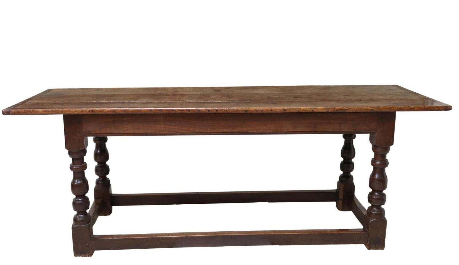 English oak refectory table, 18th century This table features a three plank top, rising on turned legs, joined with box stretcher, ending on box feet. Beautiful patina.
Three plank top was built in such a way that it can be easily removed from the