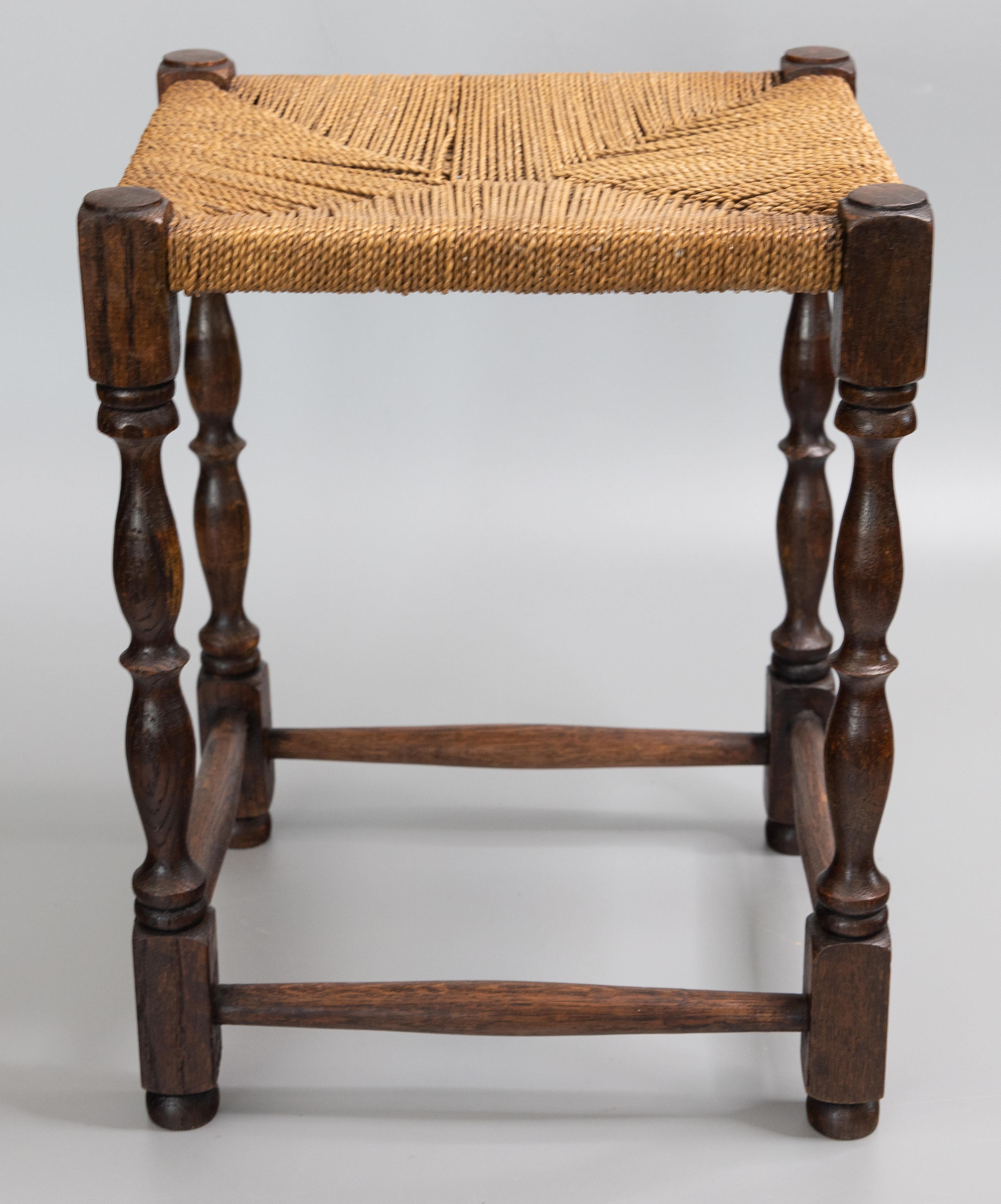 A superb English oak stool / footstool with hand turned legs and stretchers and hand woven corded string seat, circa 1900. This charming stool would make a wonderful foot rest or a small drinks table with a tray on top.

DIMENSIONS
13.75ʺW × 12.25ʺD