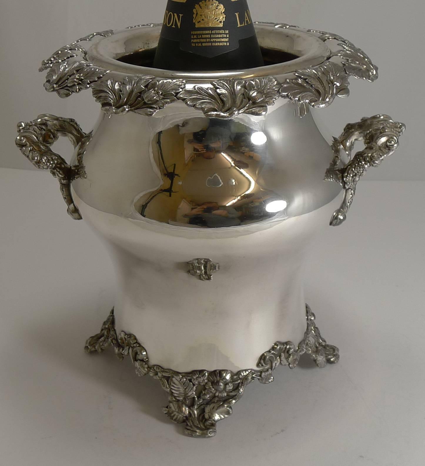 A stunning early Victorian wine cooler, made from Old Sheffield plate and standing on the most wonderful naturalistic footed base. The shape is beautiful and more unusual than most examples.

Complete with the original liner, it remains in