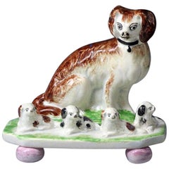 Antique English or Scottish Pottery Figure of a Spaniel with Four Pups on Bases