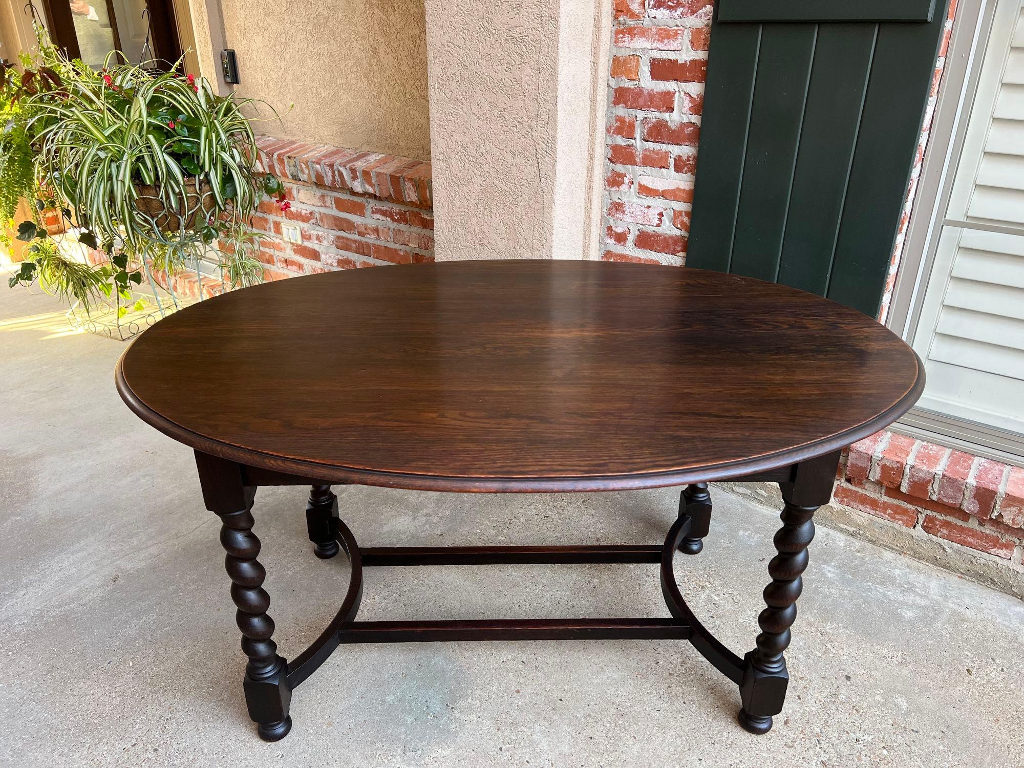 Antique English oval dining Foyer table Barley Twist Jacobean dark oak c1920.

Direct from English, we were so excited to find this amazing OVAL table in a fabulous 5 ft. length!!
The large oval table top has a beveled edge with a wide apron