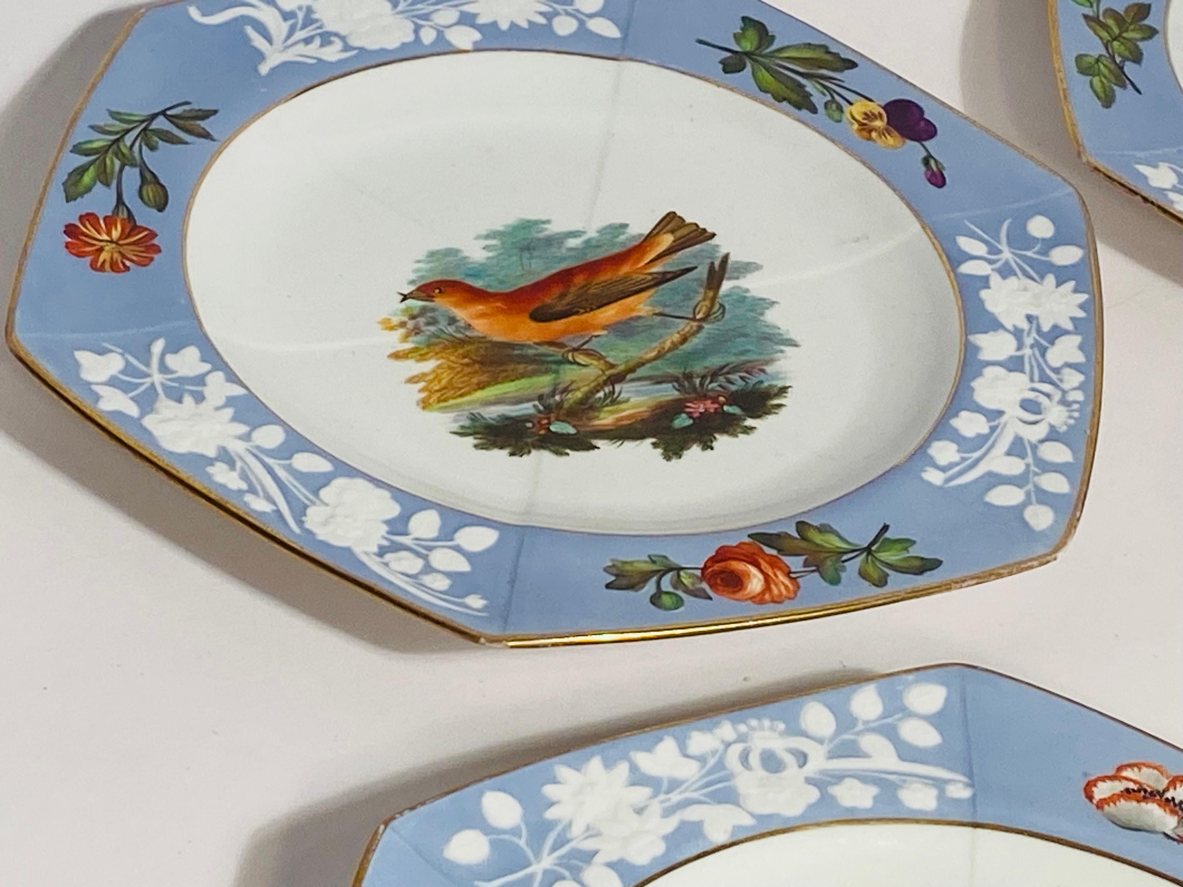 What a lovely service with so many pieces. Made by the re known English factory, Spode and hand written species detailed in script to the back of each piece. This set features a raised white floral decoration in their vibrant periwinkle or lavender