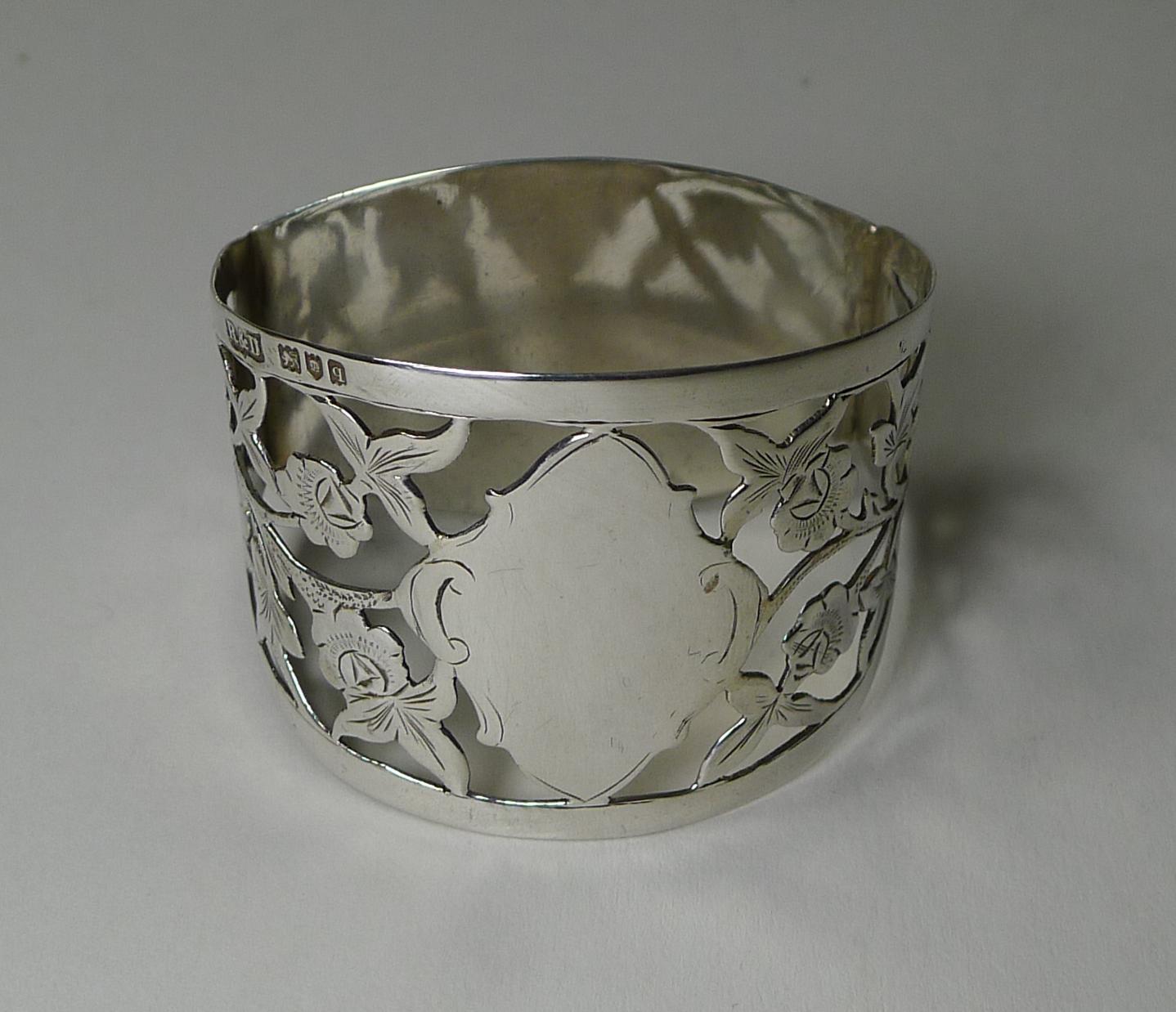 A stunning English napkin ring, pierced or reticulated, decorated with rose decoration.

Fully hallmarked for London 1911 together with the maker's mark for Roberts and Dore. 

Excellent condition measuring 2