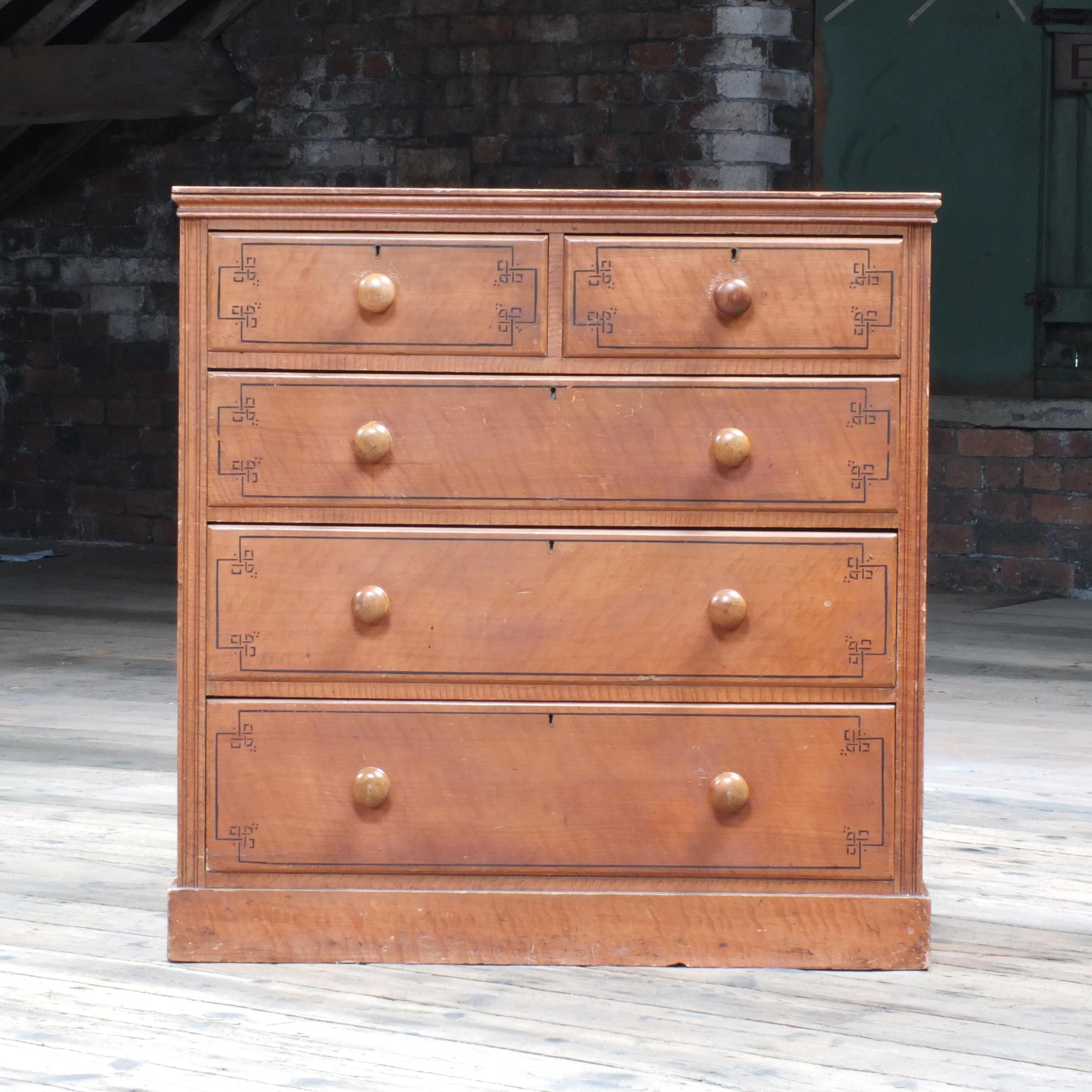 A wonderfully original set of drawers coming out of the aesthetic movement period c1870-1890. This set is particularly well done painted in a simulated satin birch and with black pin strip details. In excellent condition both inside and out!