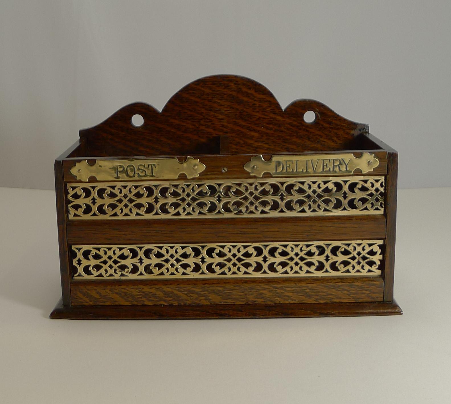 A lovely late Victorian letter box made from solid English oak and created to either use desk-top or to be hung on the wall.

These letter collection boxes date back to a more civilized time, when letters in a grand house would be placed in the