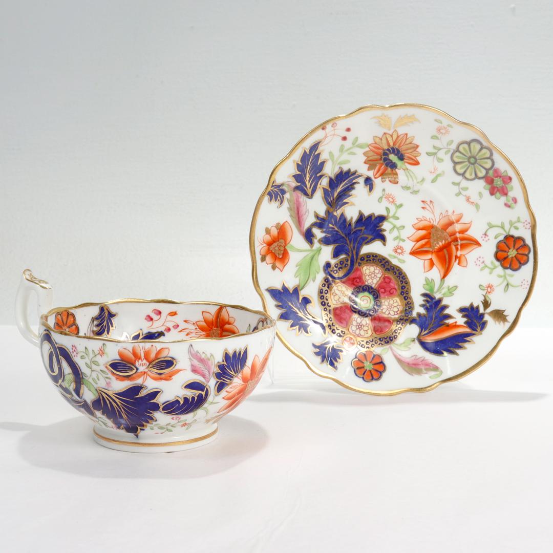 A fine antique porcelain cup and saucer.

In the Pseudo-Tobacco Leaf pattern, mimicking the Chinese Export pattern of the late 18th Century.

Attributed to Copeland Spode.

Both cup and saucer have a gilt scalloped rim and are decorated in