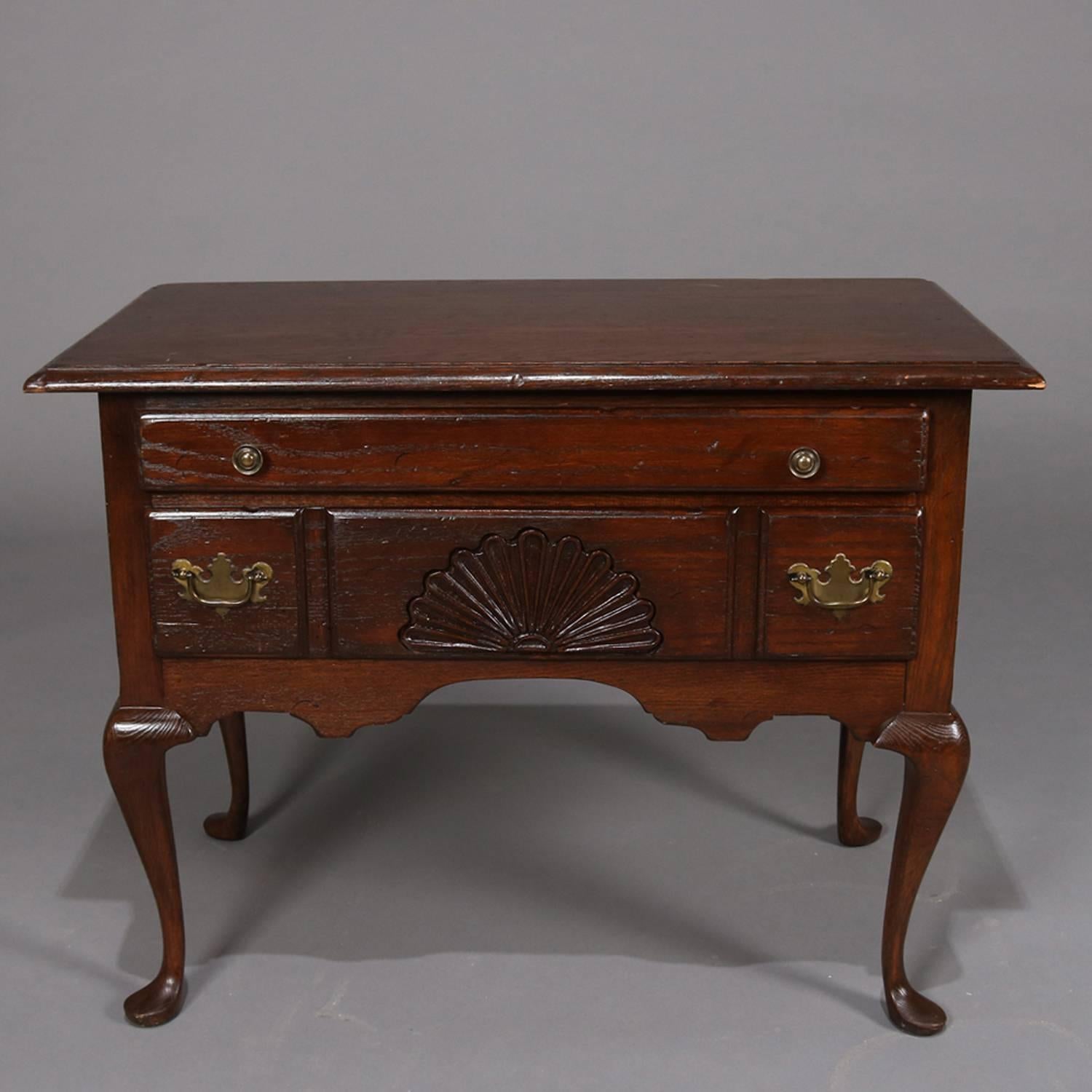 Antique English Queen Anne Baker School Cushman Classics lowboy by H.T. Cushman manufacturing company/general interiors, N. Bennington, VT features upper long drawer above smaller long drawer with central carved shell over scalloped skirt and seated