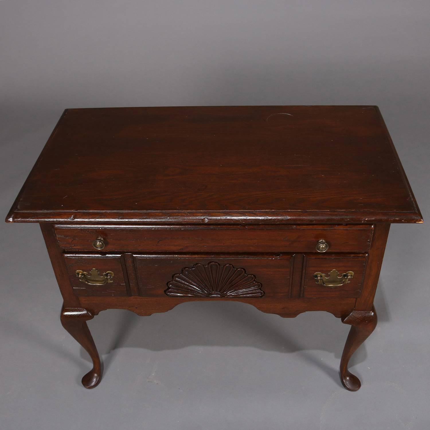 20th Century Antique English Queen Anne Style Baker School Two-Drawer Caved Mahogany Lowboy