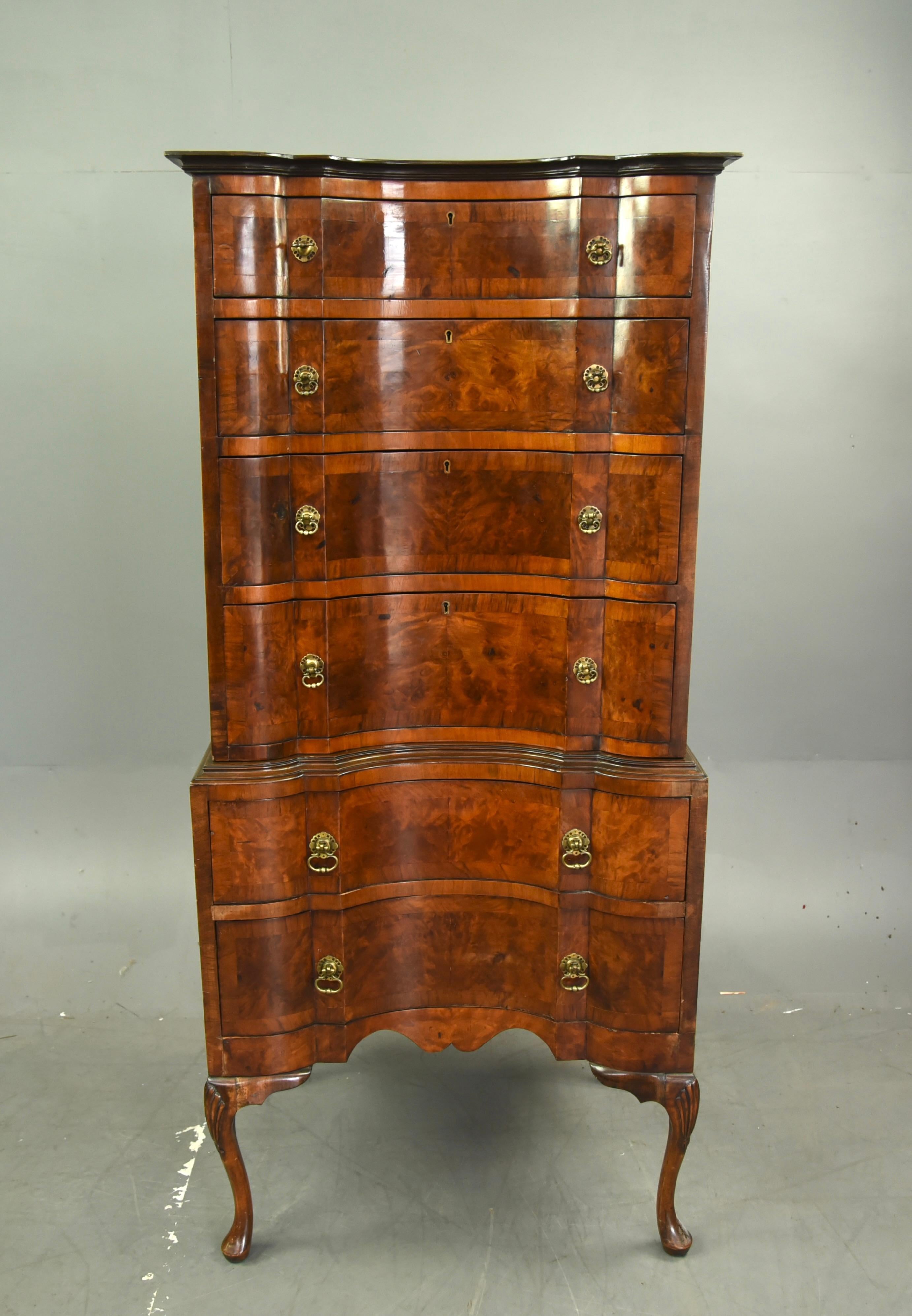 A Fine quality Queen Anne revival burr walnut chest on chest circa 1900 .
The wonderful conceive shaped 6 drawer walnut chest on chest has been crafted by a top quality cabinet maker of the time , the chest has a fantastic shape with wonderful full