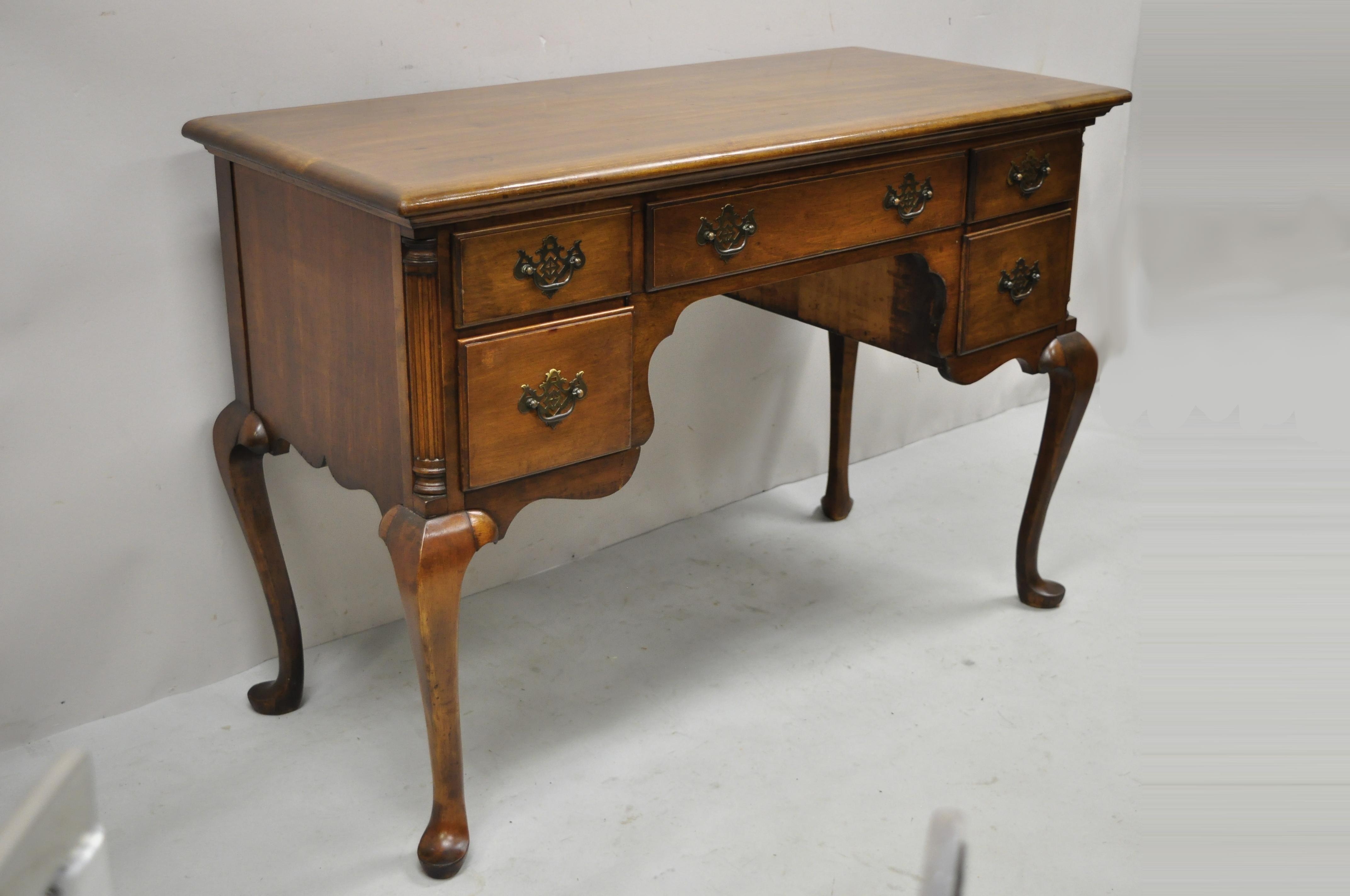 Antique English Queen Anne style mahogany kneehole writing desk with 5 Drawers. Item features shapely Queen Anne legs, solid wood construction, beautiful wood grain, 5 dovetailed drawers, solid brass hardware, very nice antique item, great style and