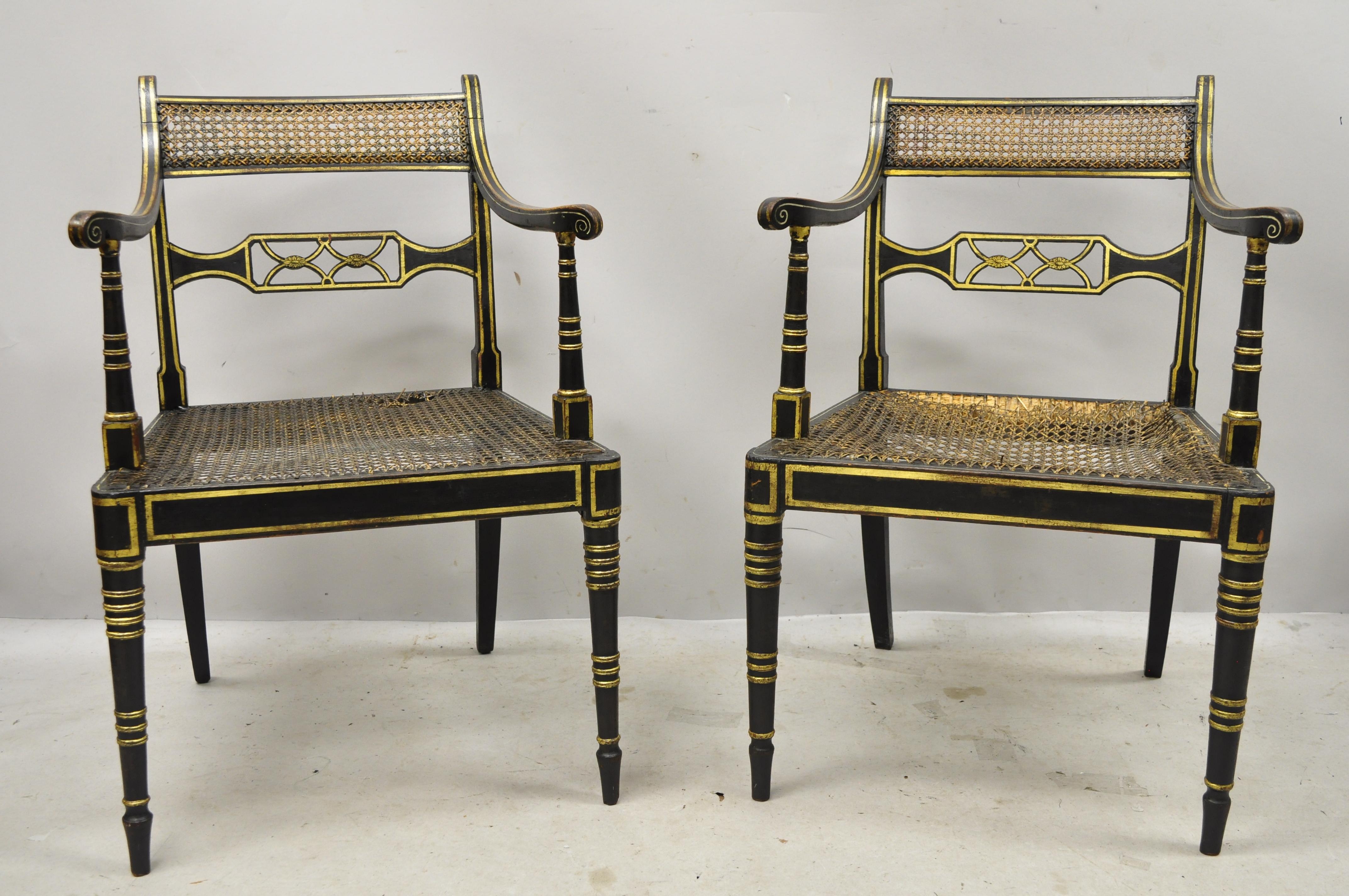 Antique English Regency black ebonized cane armchairs - a pair. Item features solid wood frame, black distressed finish, cane back and seat, very nice antique item, quality English craftsmanship, circa late 19th-early 20th century. Measurements: