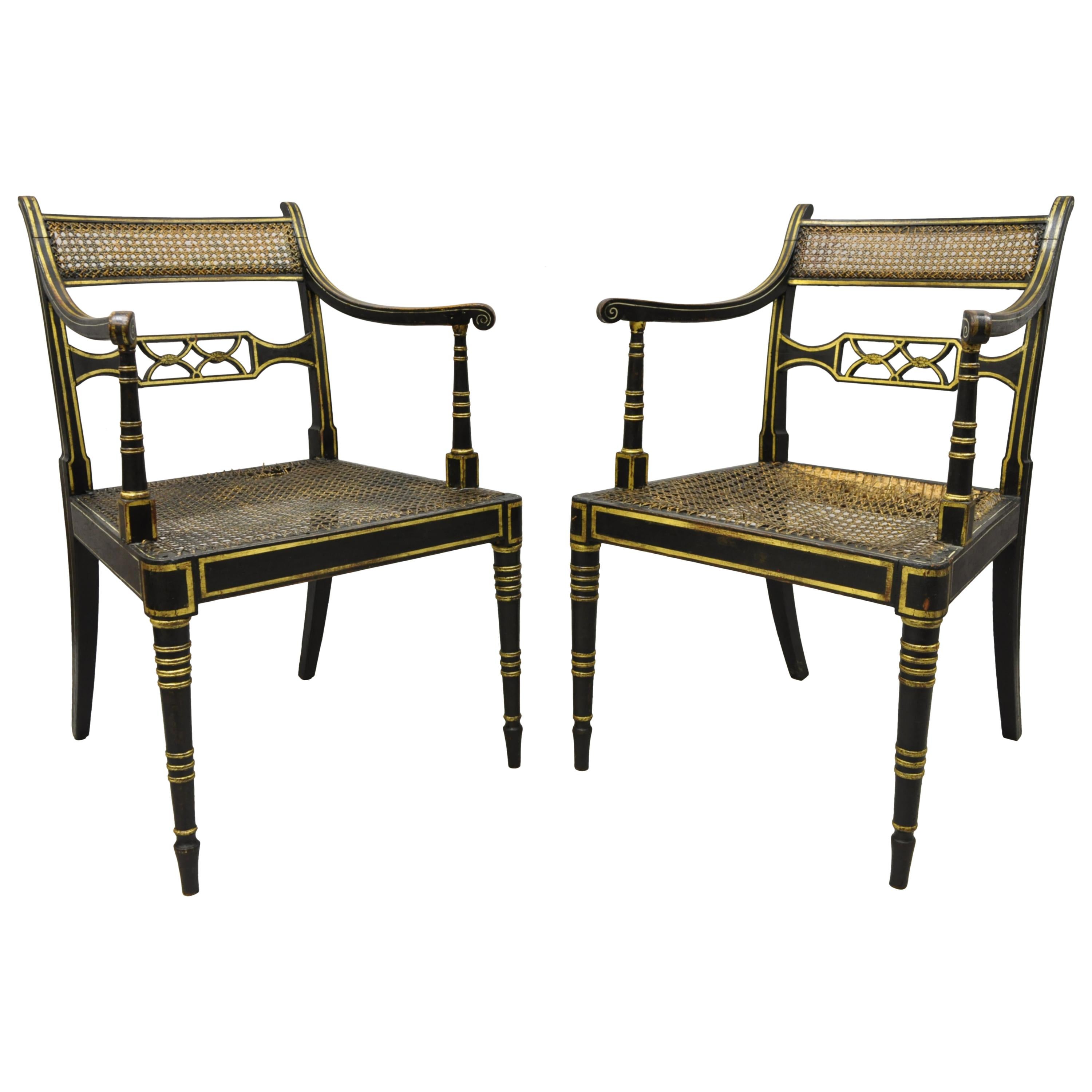 Antique English Regency Black and Gold Ebonized Cane Armchairs, a Pair