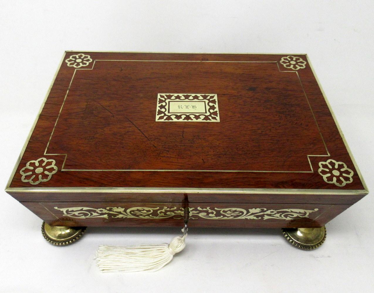 An exceptionally fine quality example of a Lady’s or Gentleman’s English Regency Period polished brass mounted Flame Mahogany Inlaid Boulle Style Jewellery or Trinket Casket or Table Box made during the first quarter of the Nineteenth Century, of