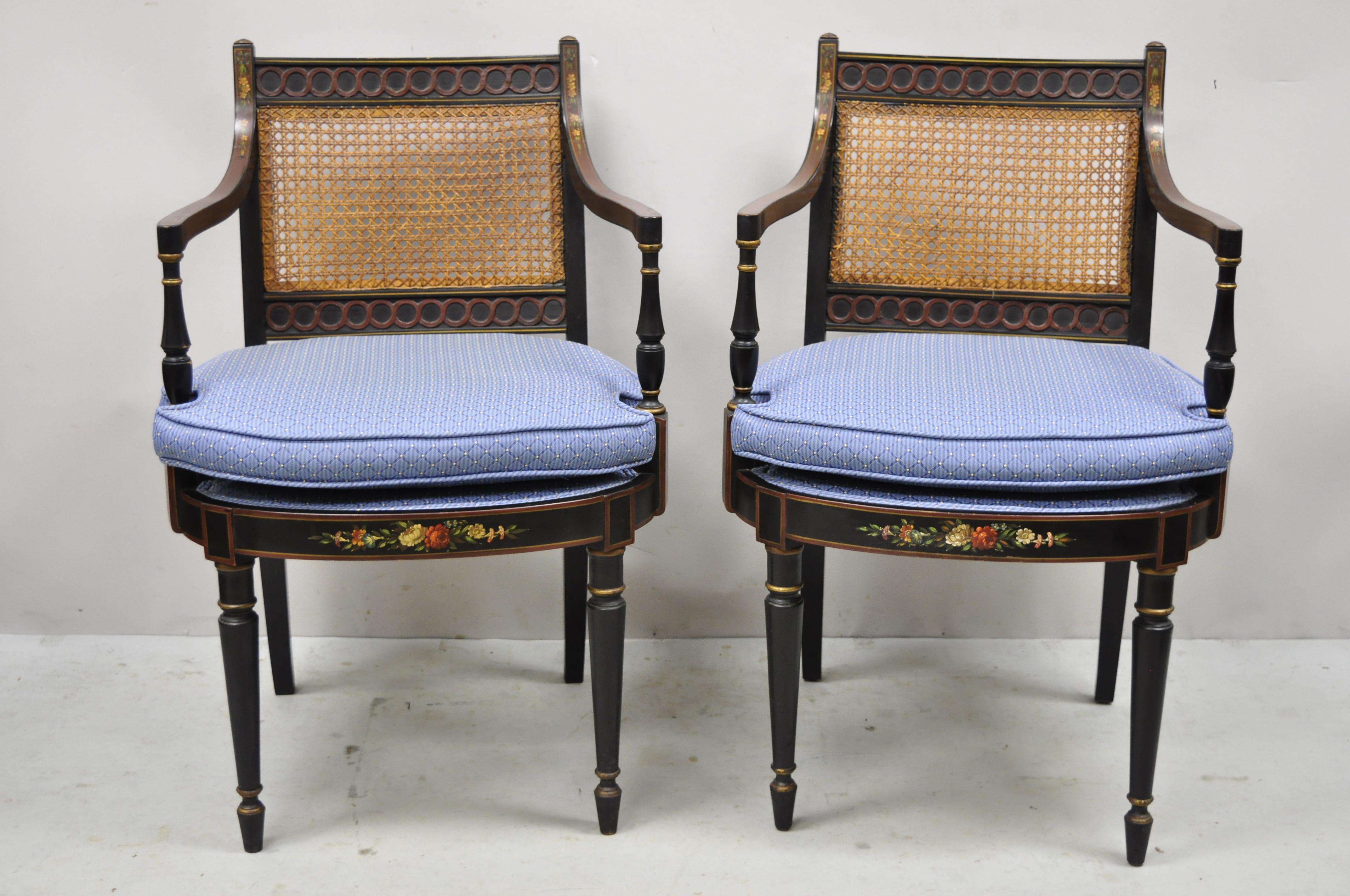Antique English Regency Ebonized black cane back hand painted arm chairs - a Pair. Item features hand painted floral details, ebonized black finish, cane back, solid wood frames, tapered legs, very nice antique pair, quality craftsmanship, great