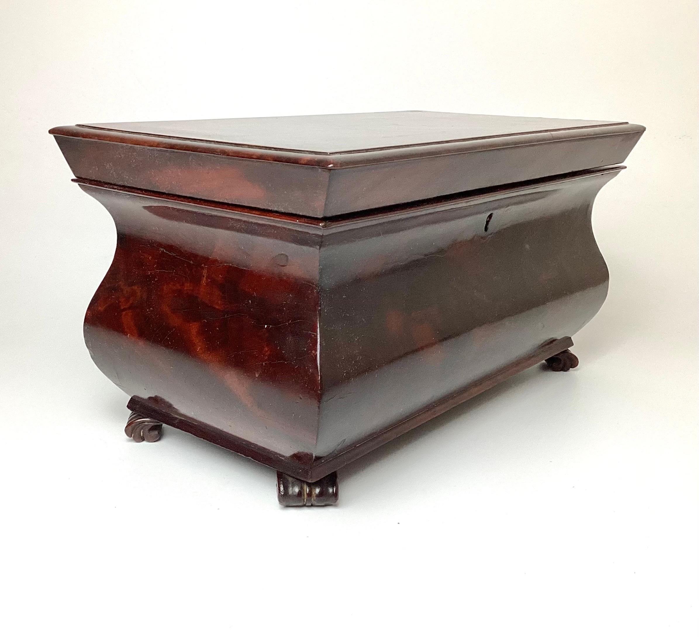 A very fine regency period mahogany tea caddy. Wonderful early surface that is rich with patina. The box expertly conceived and executed. The lid opens to reveal two lidded compartments, each of which is its own self-contained mahogany box. These